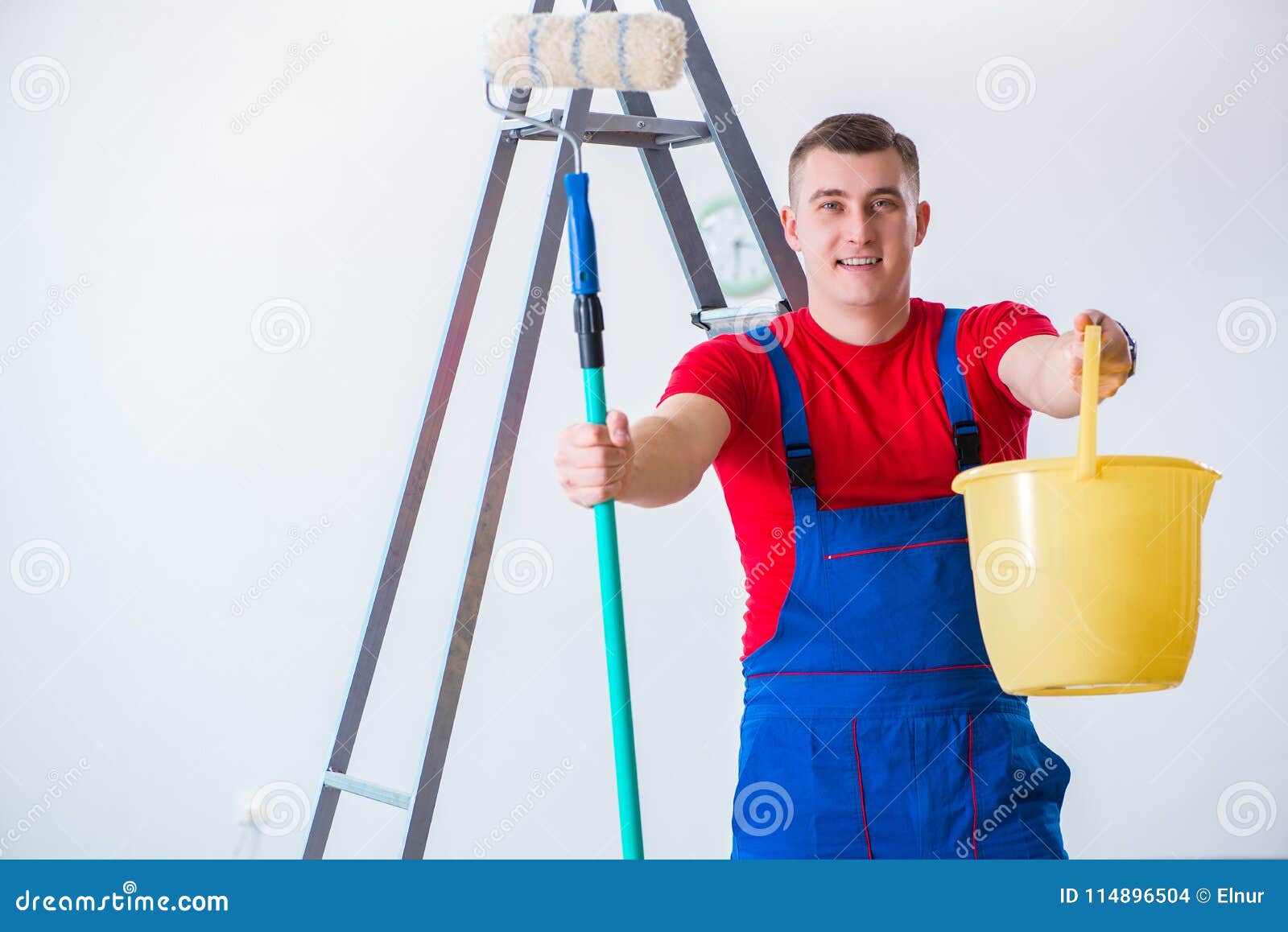 The Male Painter Preparing for Painting Job at Construction Site Stock
