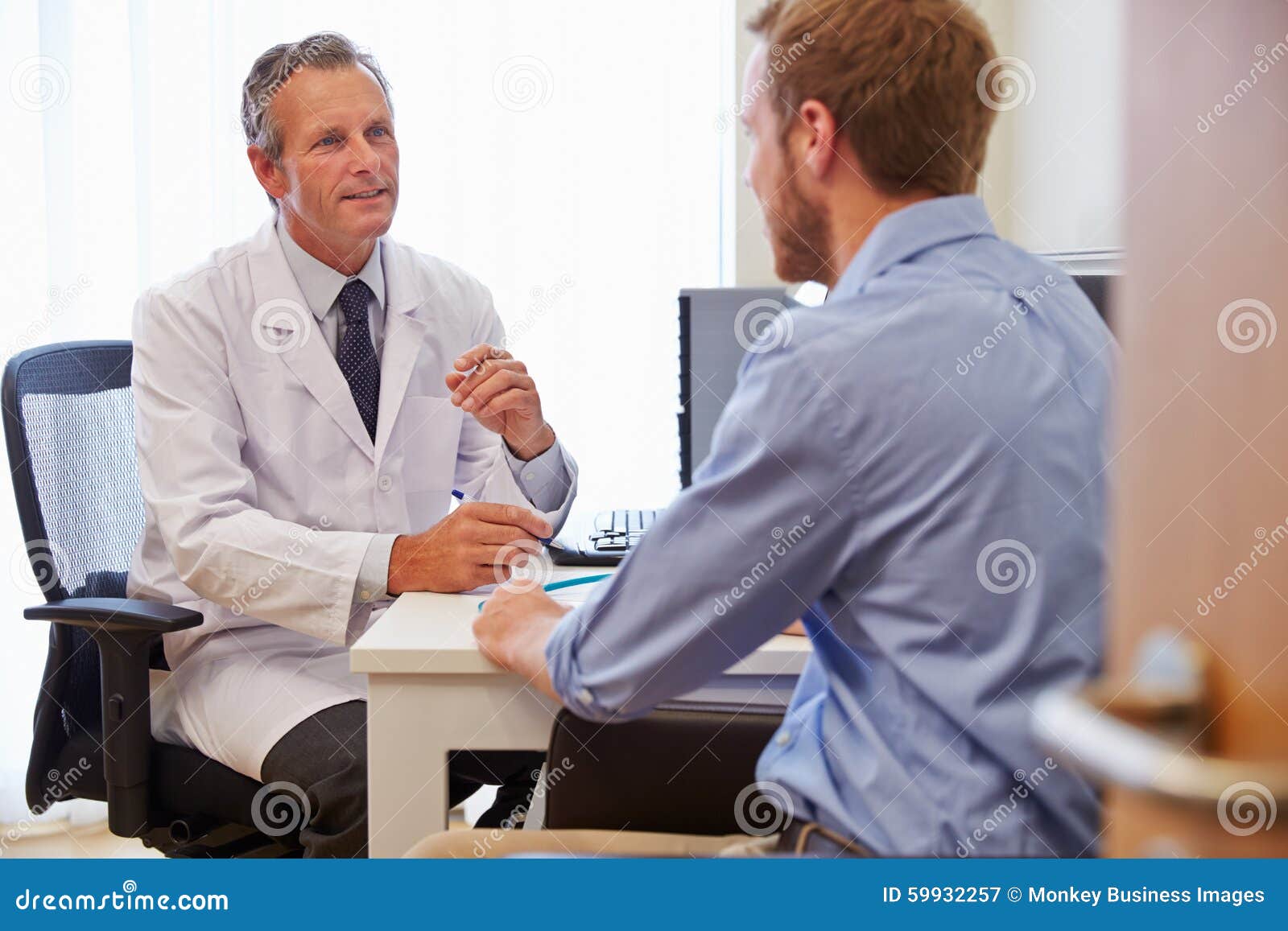 male patient having consultation with doctor in office
