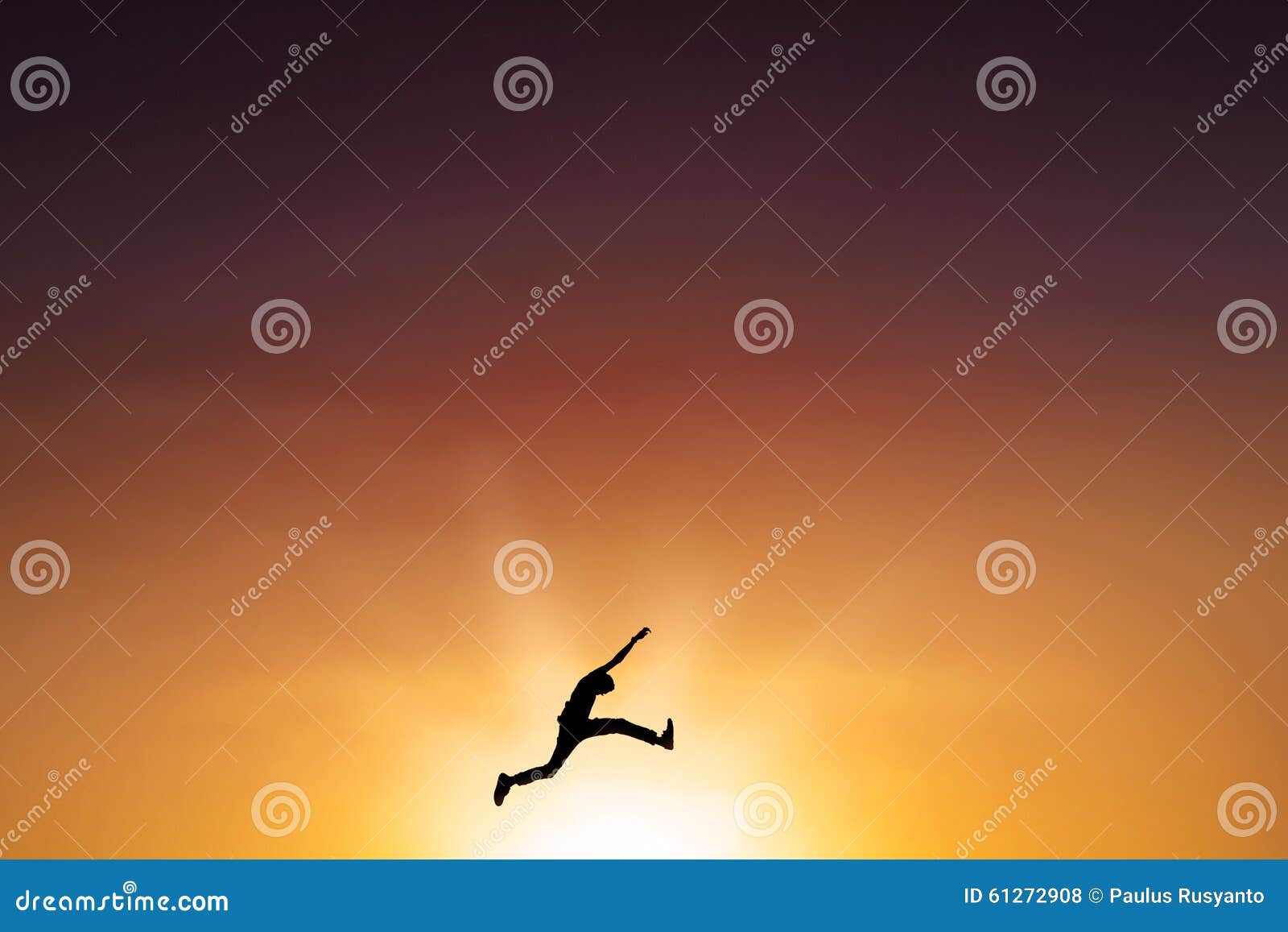 male person leaps on the air at dusk time