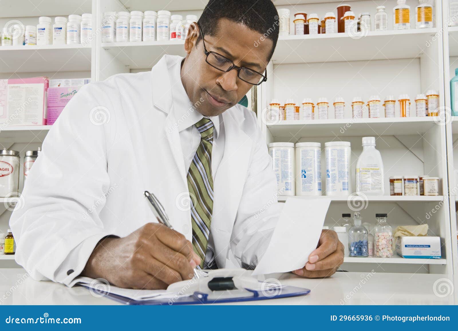 male pharmacist working in pharmacy