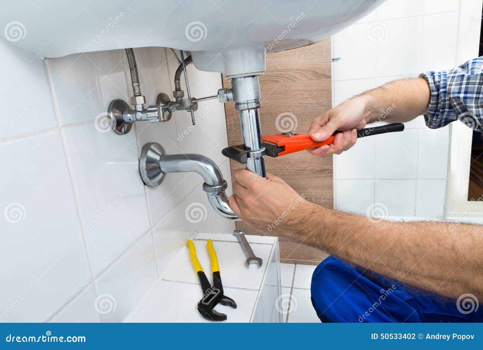 Male Plumber Fixing Sink in Bathroom Stock Photo Image of interior, plumber 50533402