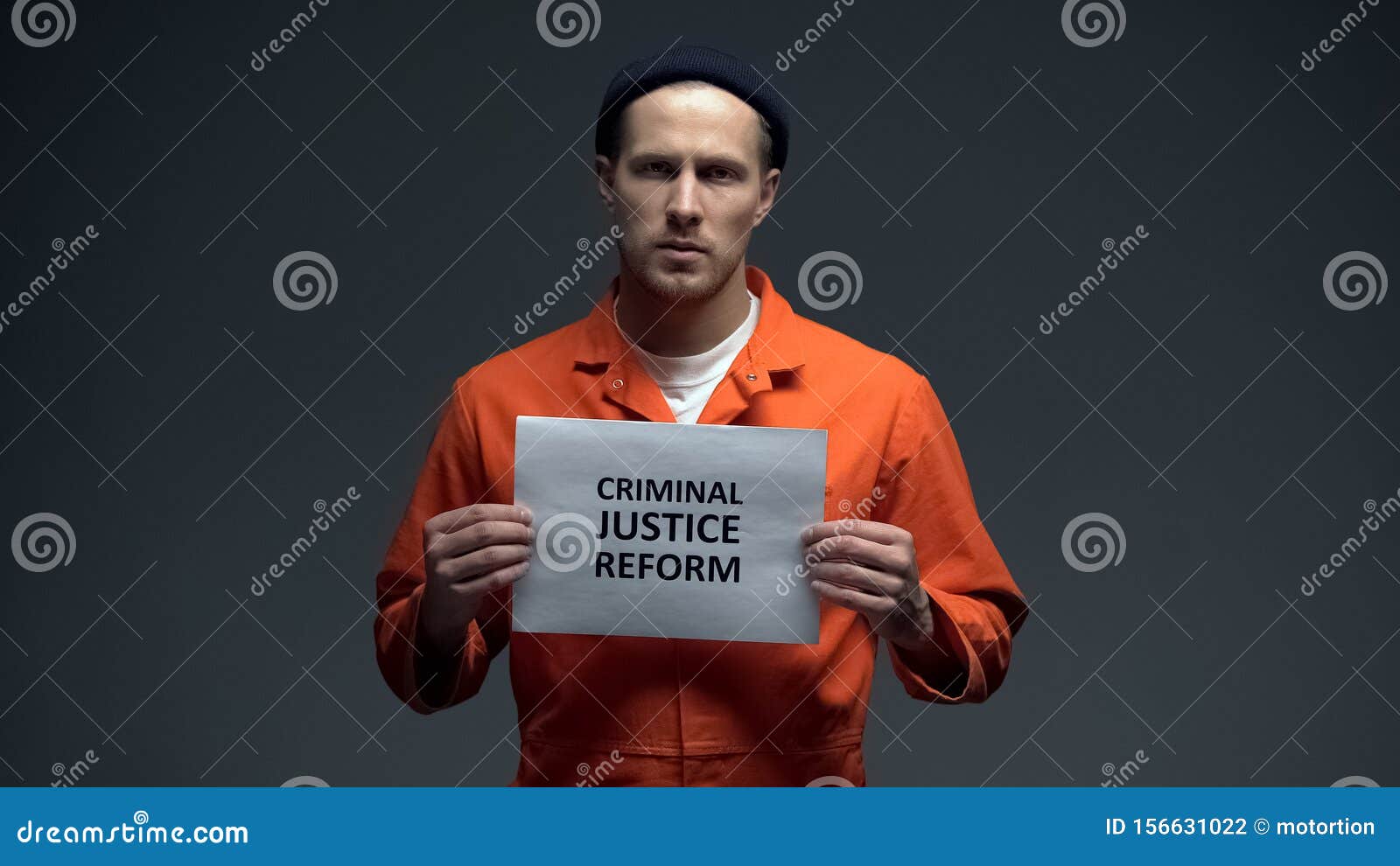 male prisoner holding criminal justice reform sign, human rights protection