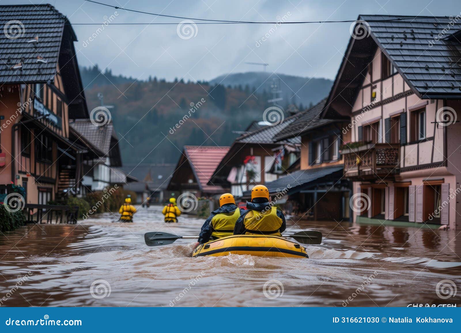 male rescuers sail a boat through a flooded city during a flood. rescue operation