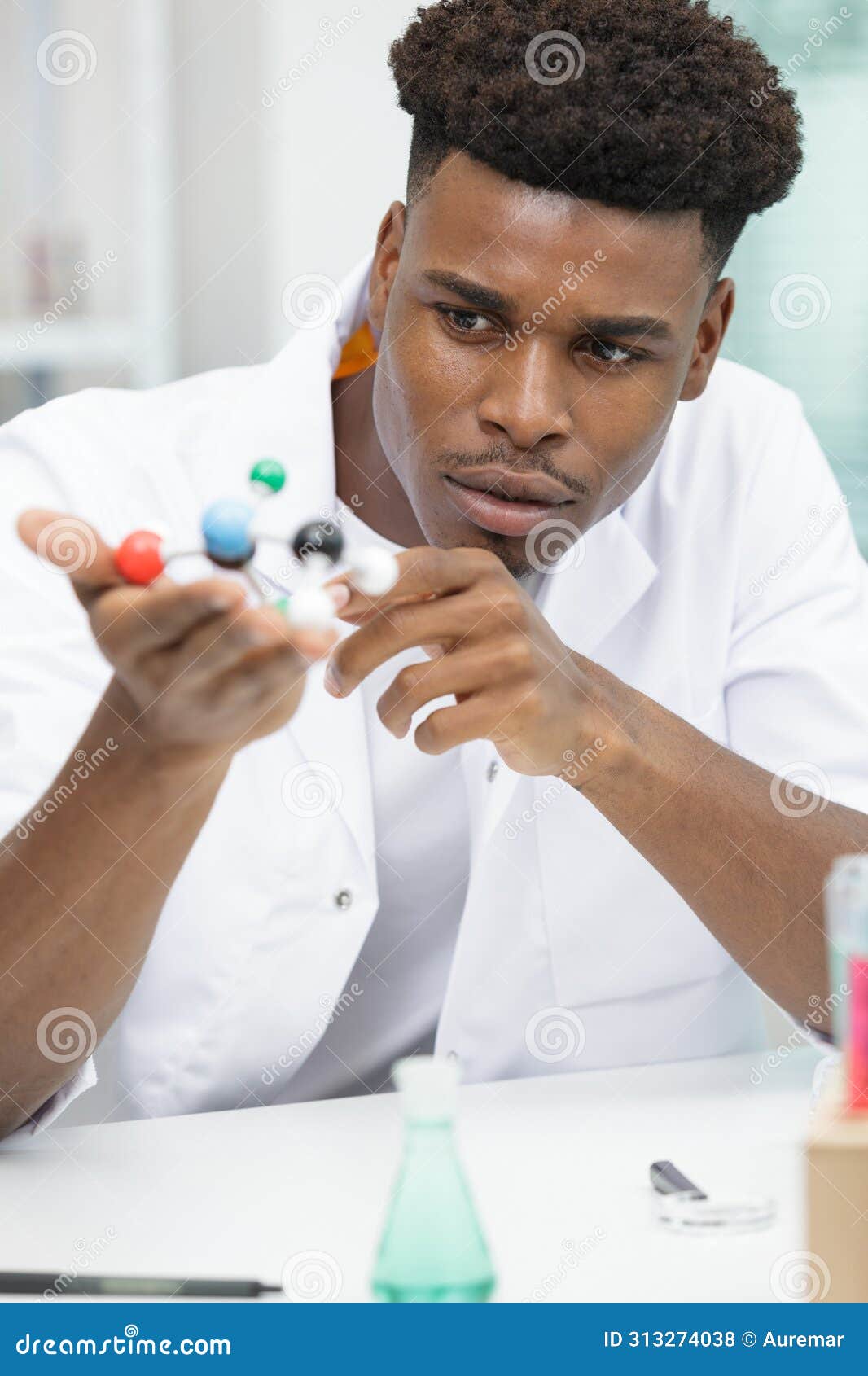 male scientist with molecules model
