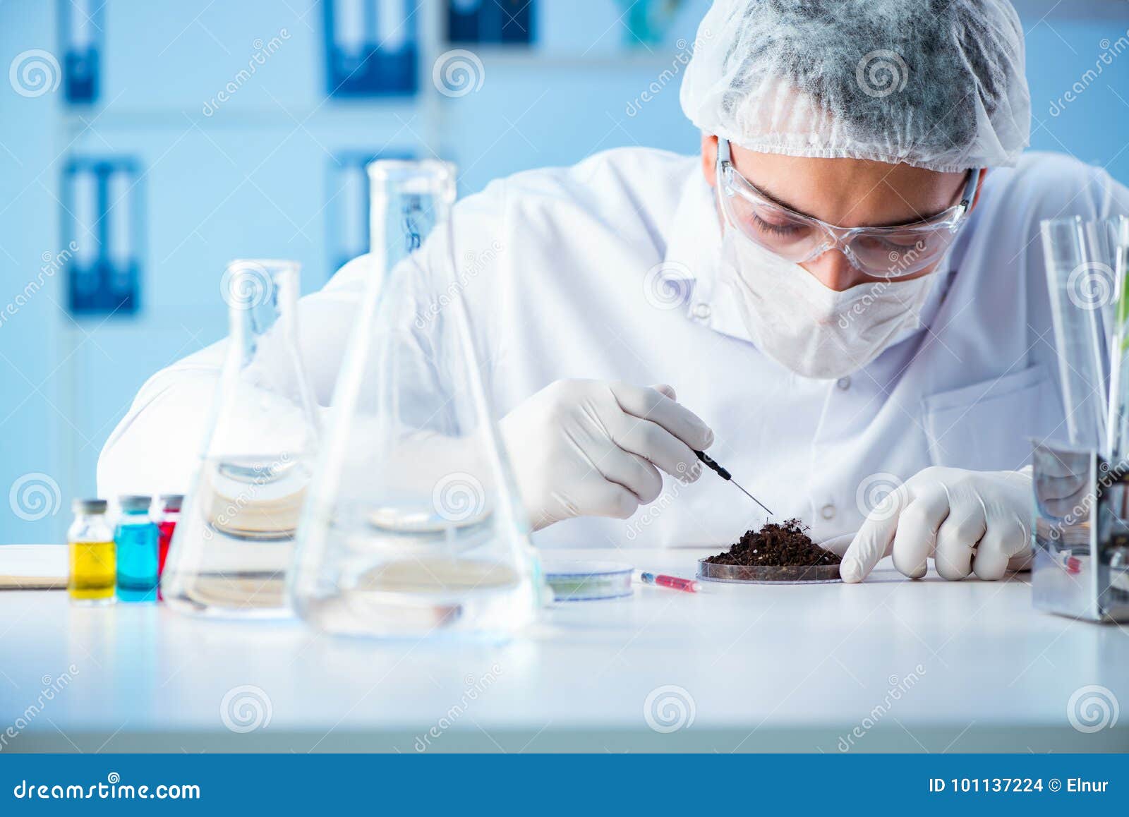 The Male Scientist Researcher Doing Experiment in a Laboratory Stock