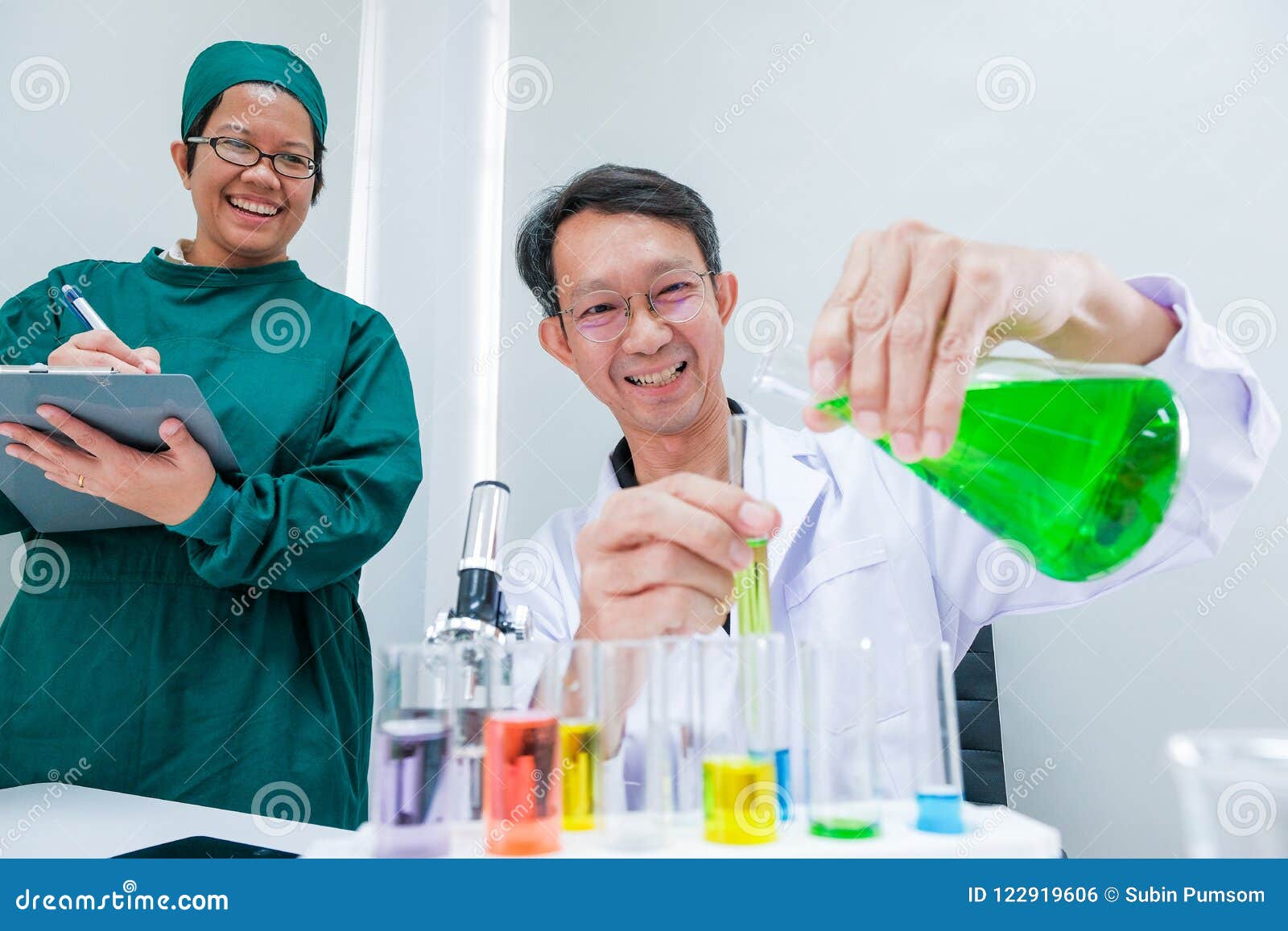 male scientist standing with techer in lab worker making medical