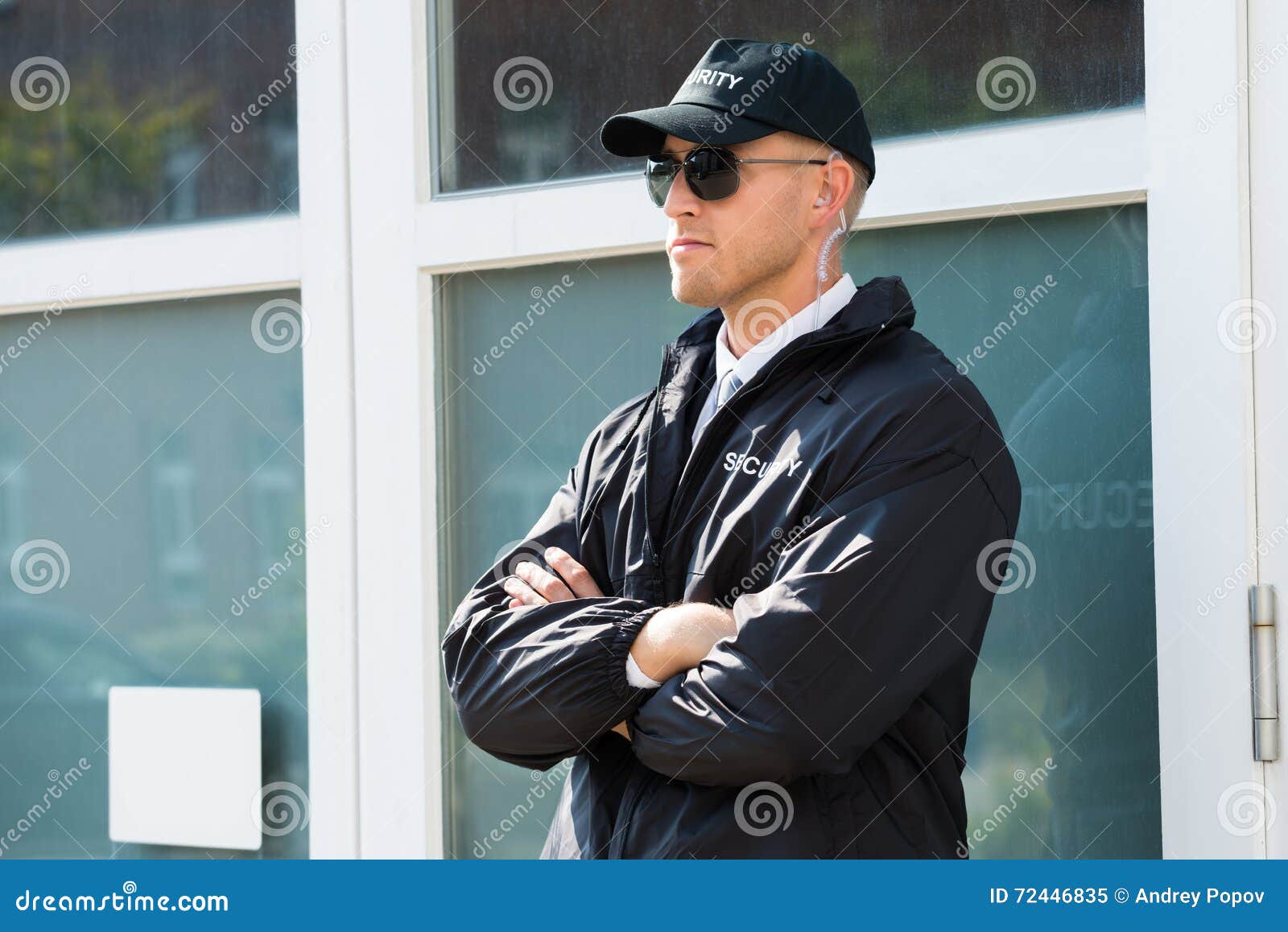 male security guard standing at the entrance