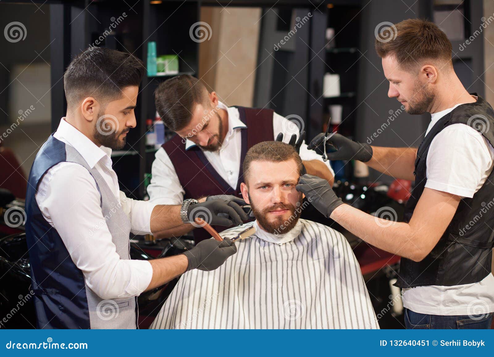 Male Sitting In Chair While Hairdressers Servicing Him Stock Image