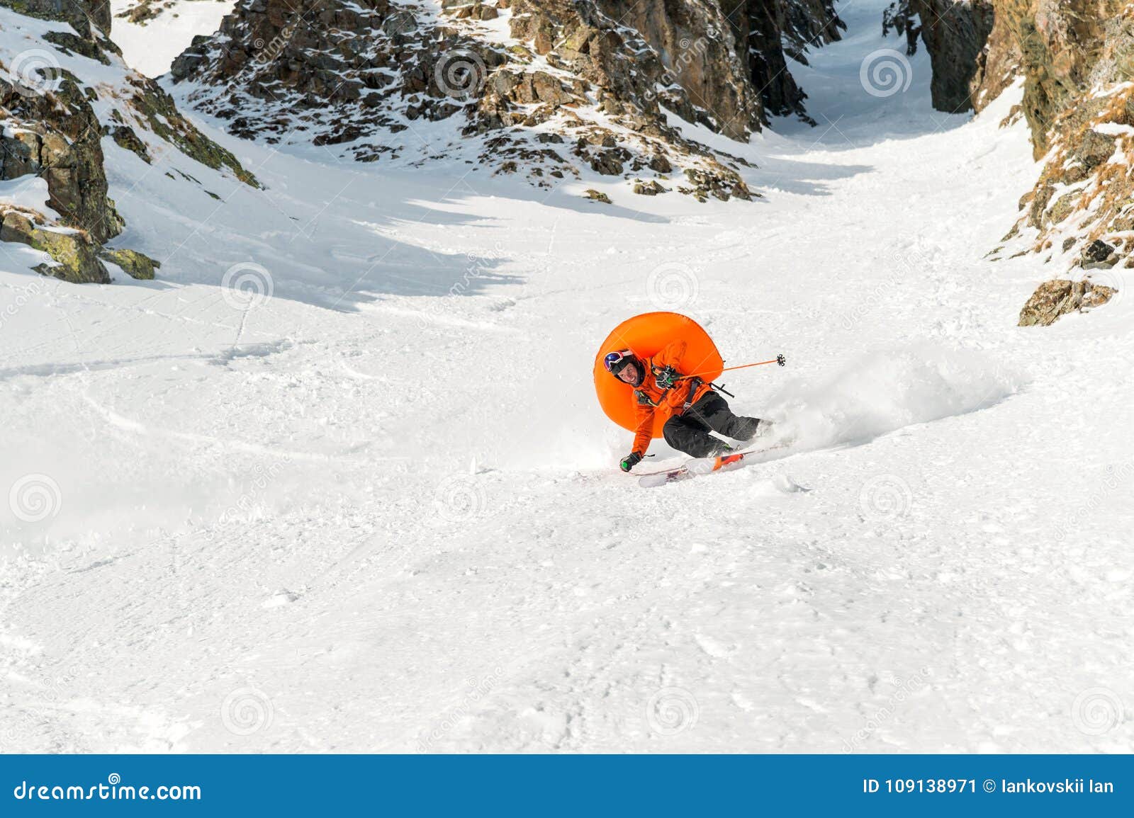 A Male Skier Freerider with a Beard Descends the Backcountry at High ...