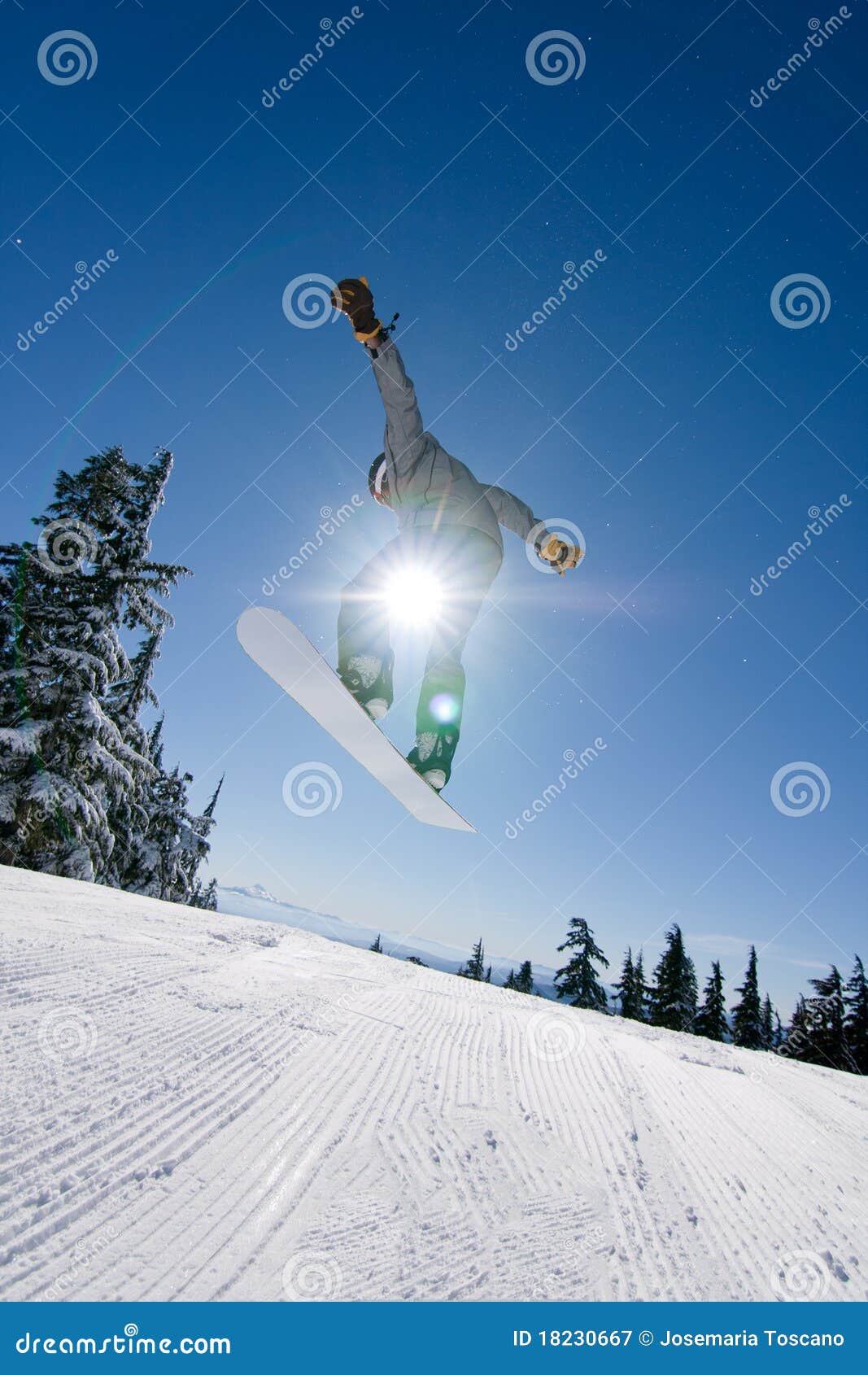 male snowboarder catches big air.