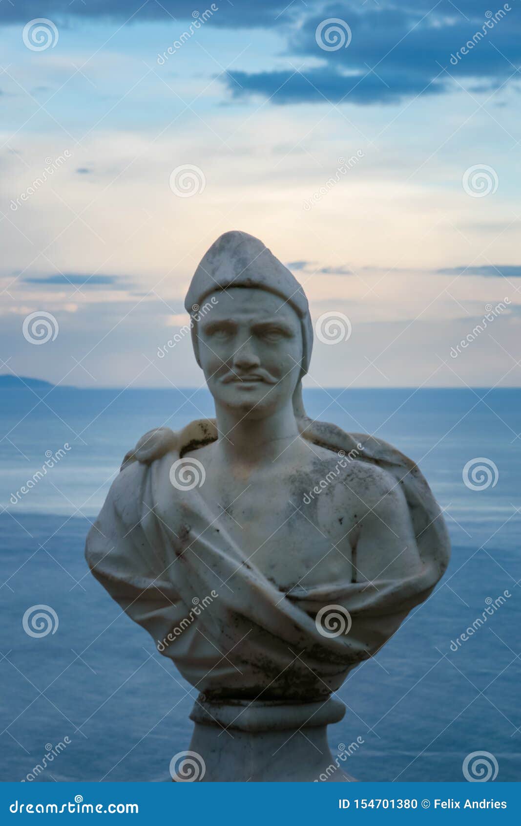 male statue from the belvedere, the so-called terrazza dell`infinito, the terrace of infinity seen on the sunset, villa cimbrone,