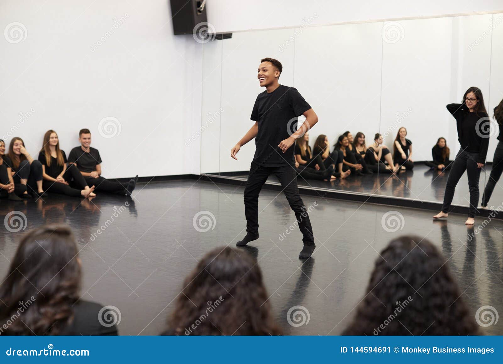 Male Student at Performing Arts School Performs Street Dance for Class
