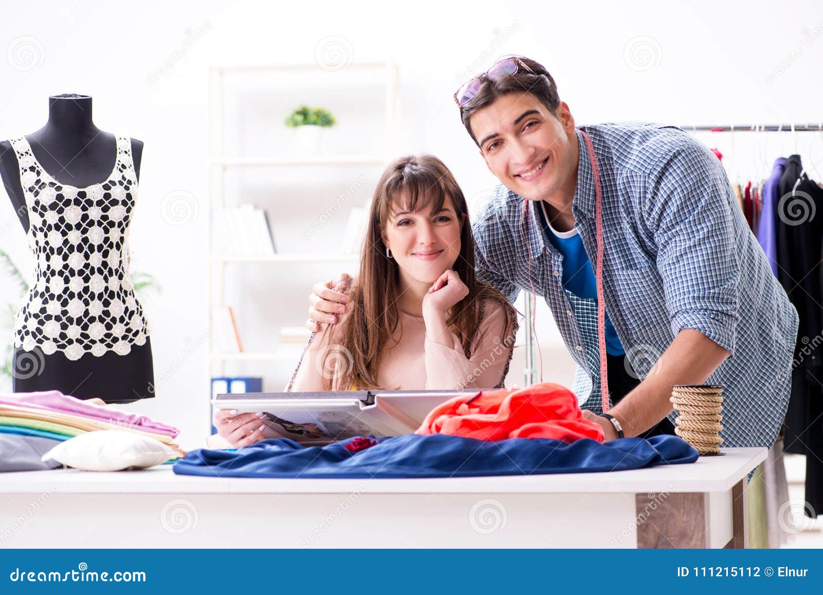 The Male Tailor with Female Student in Workshop Stock Photo - Image of ...