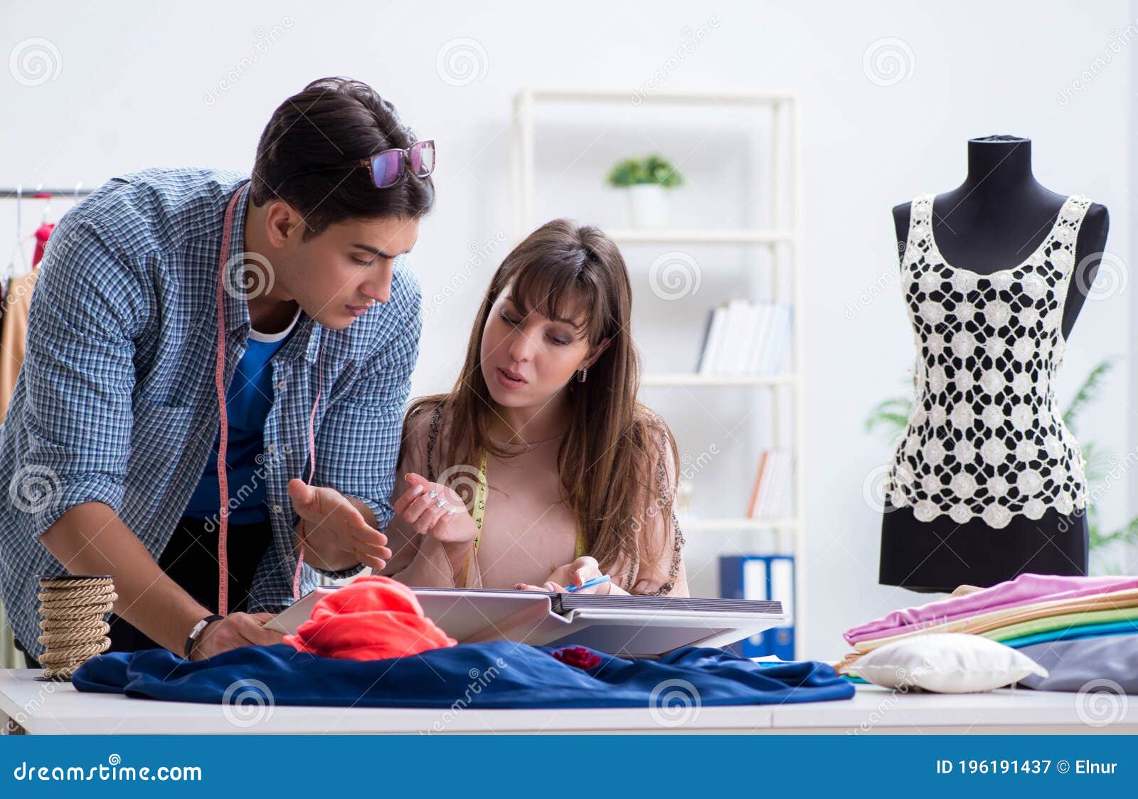 Male Tailor with Female Student in Workshop Stock Image - Image of ...