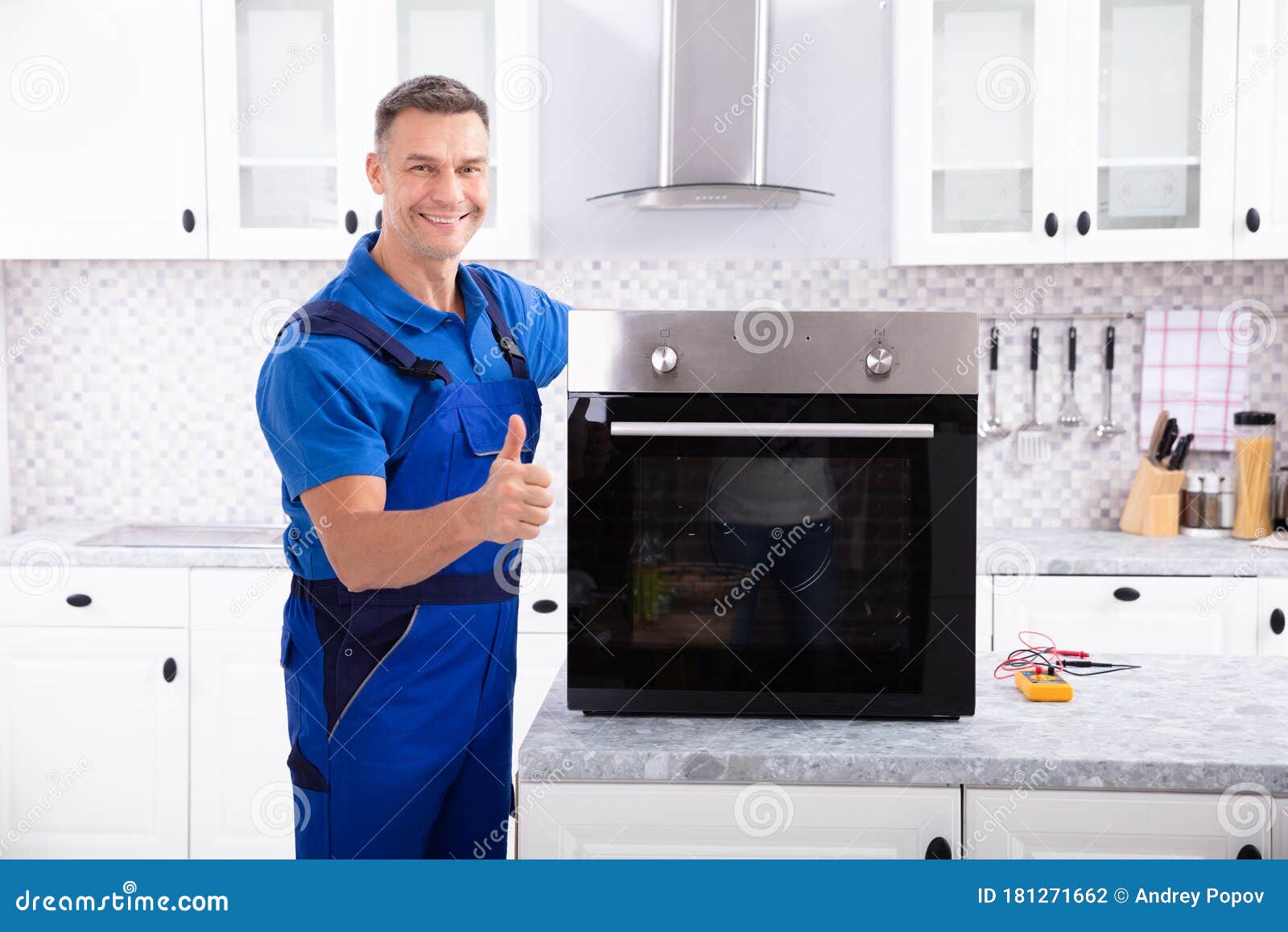 Male Technician Repairing Oven Stock Photo Image of electrician