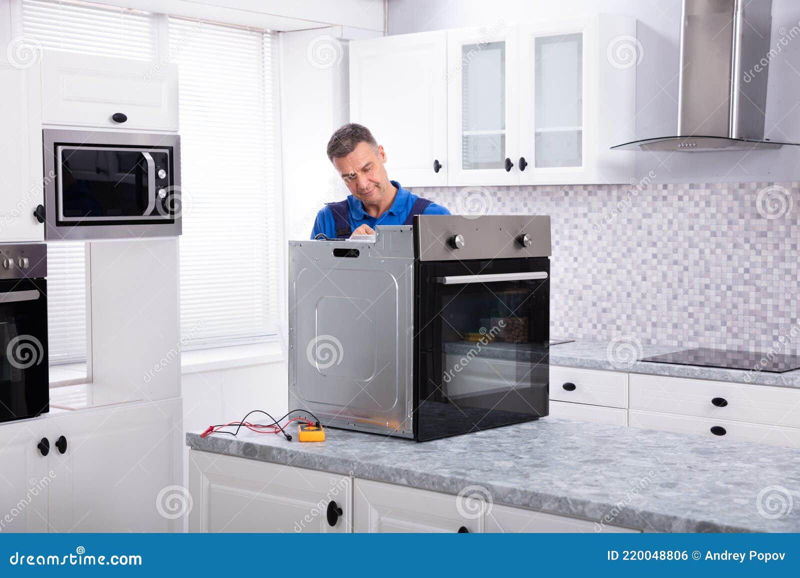 Male Technician Repairing Oven Stock Photo Image of repair