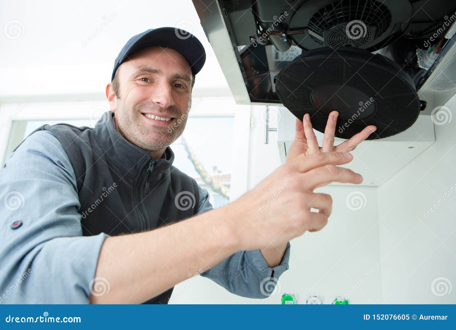 Male Technician Working on Kitchen Extractor Filter Stock Image Image