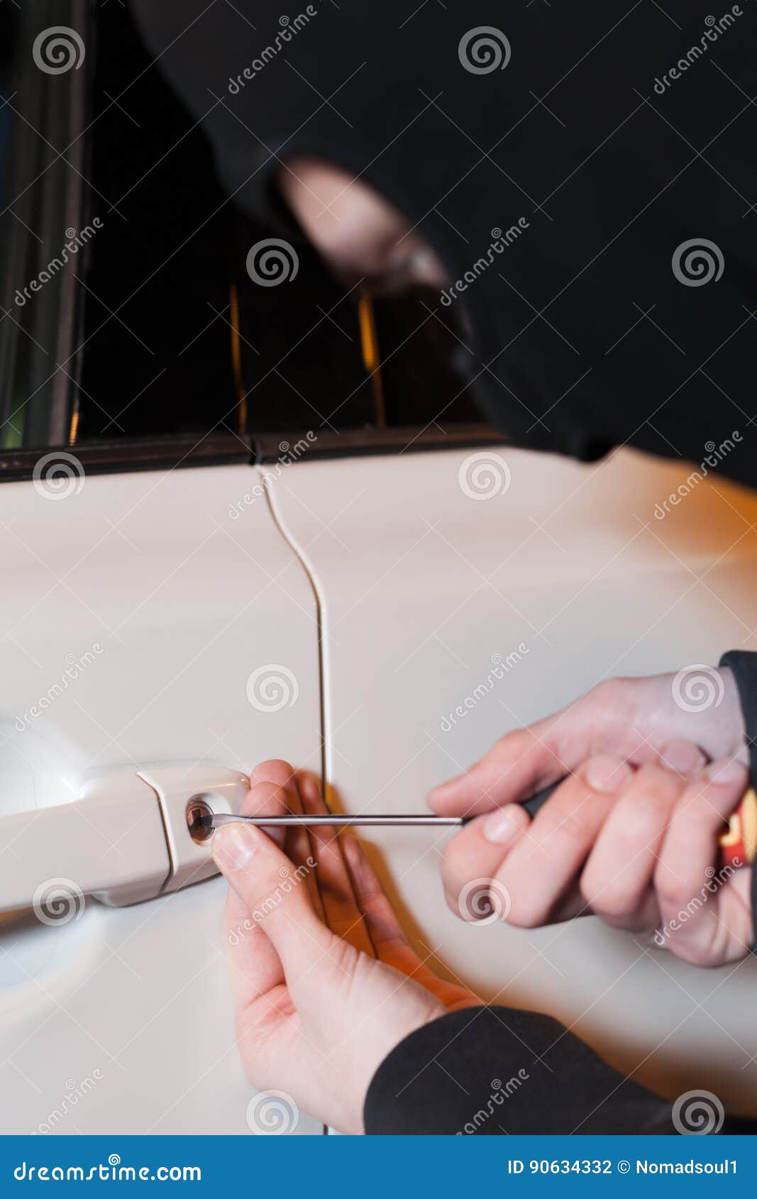 Male Thief Hands Open Car Door With Screwdriver Stock Photo
