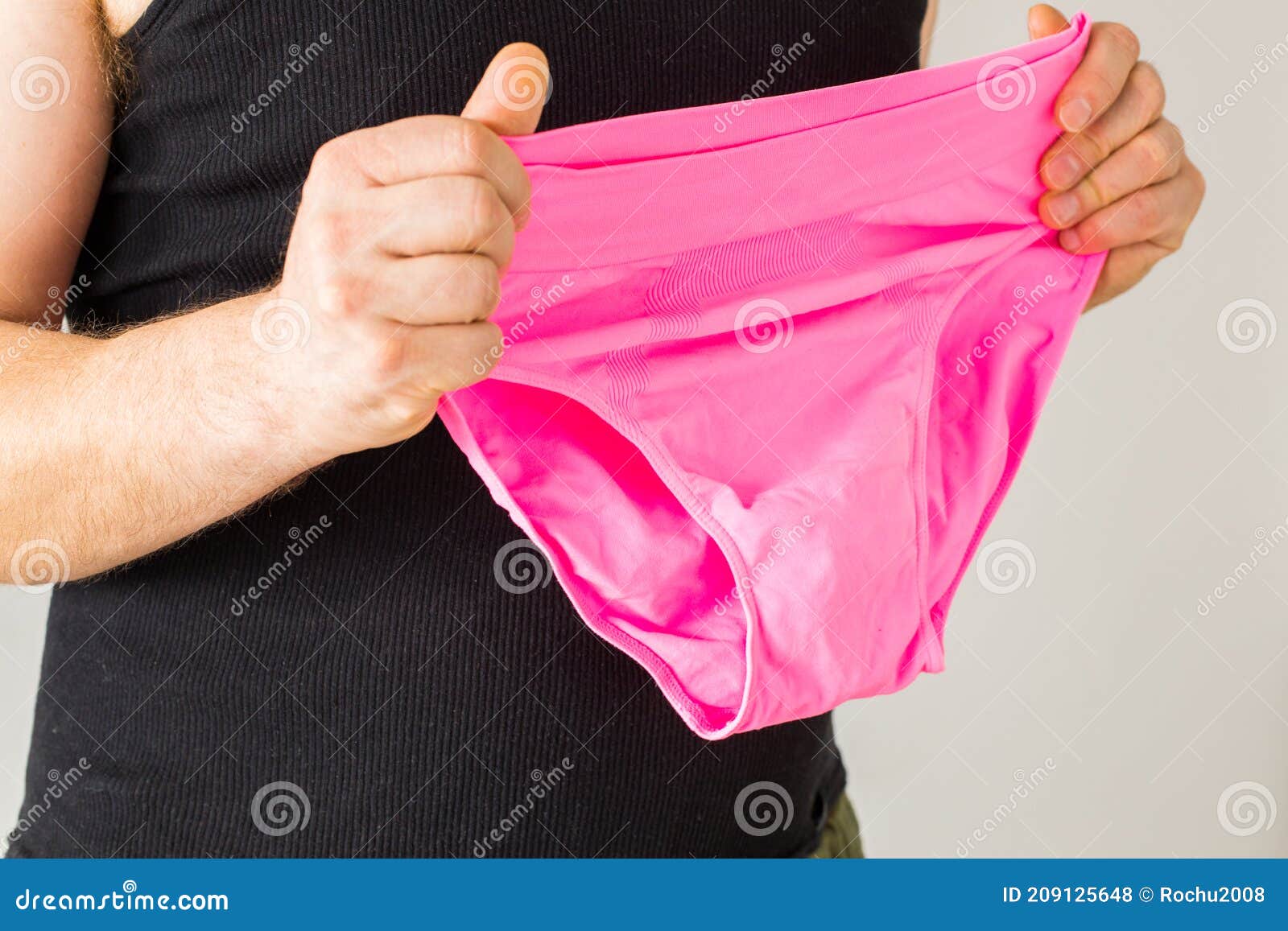 The Male Type of a Man Holds Pink Panties in His Hands Stock Photo - Image  of openness, courage: 209125648