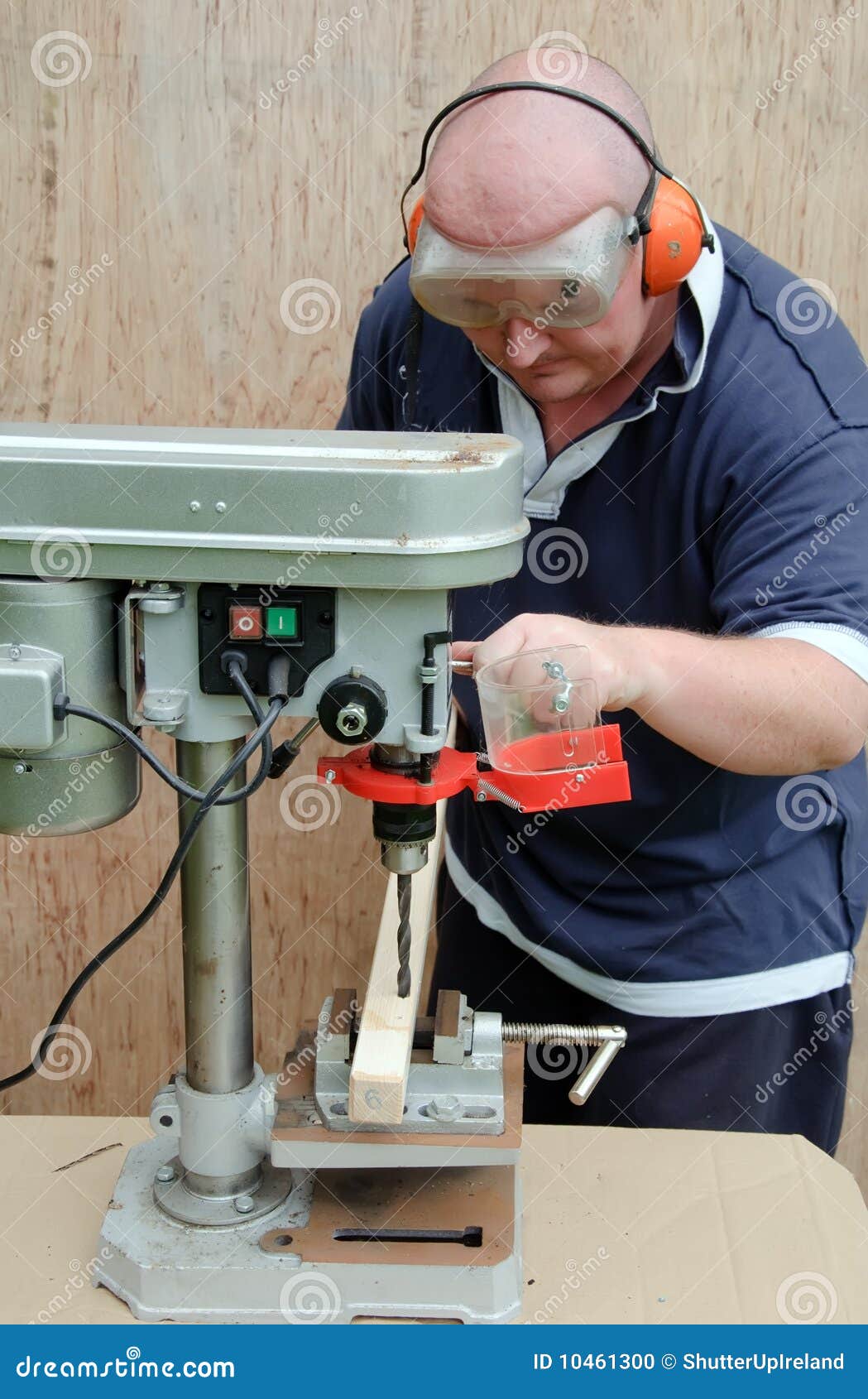 Male Using a Drill Press on Wood Stock Photo Image of woodworking