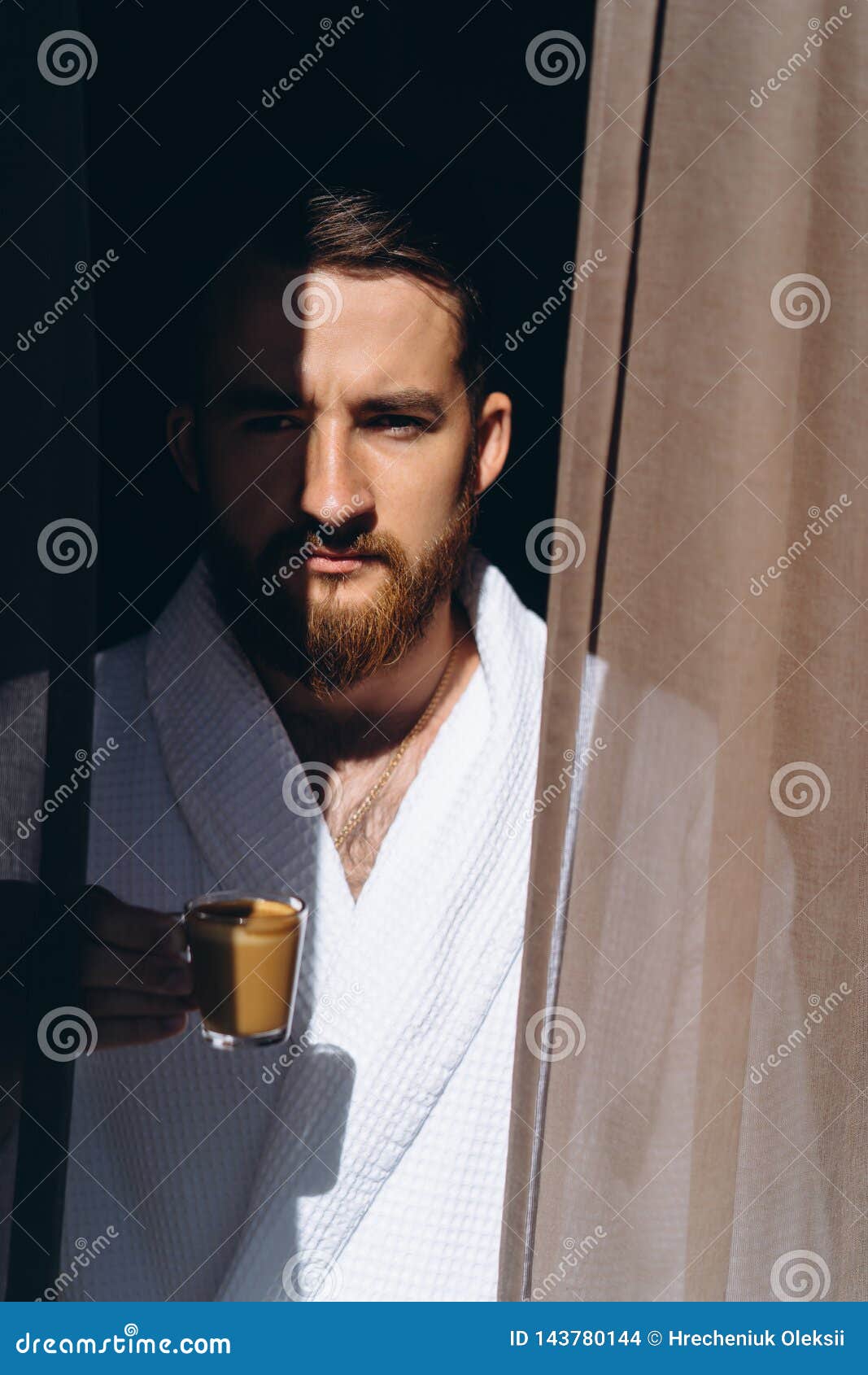 Male in White Bathrobe with Coffee Mug in Hand. Stock Photo Image of window, caucasian 143780144