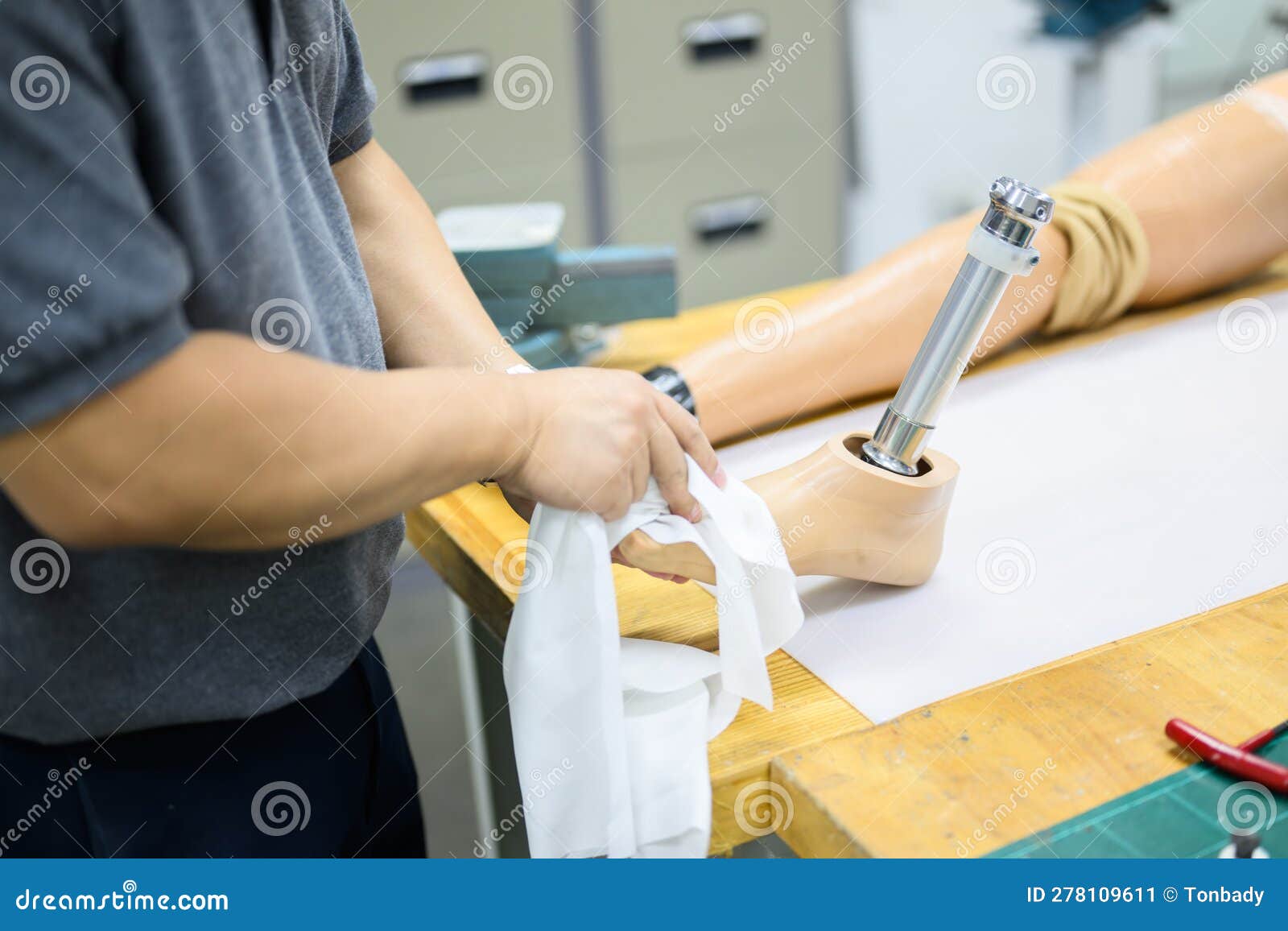 Male Worker Assembling Parts of Artificial Leg in Prosthetic