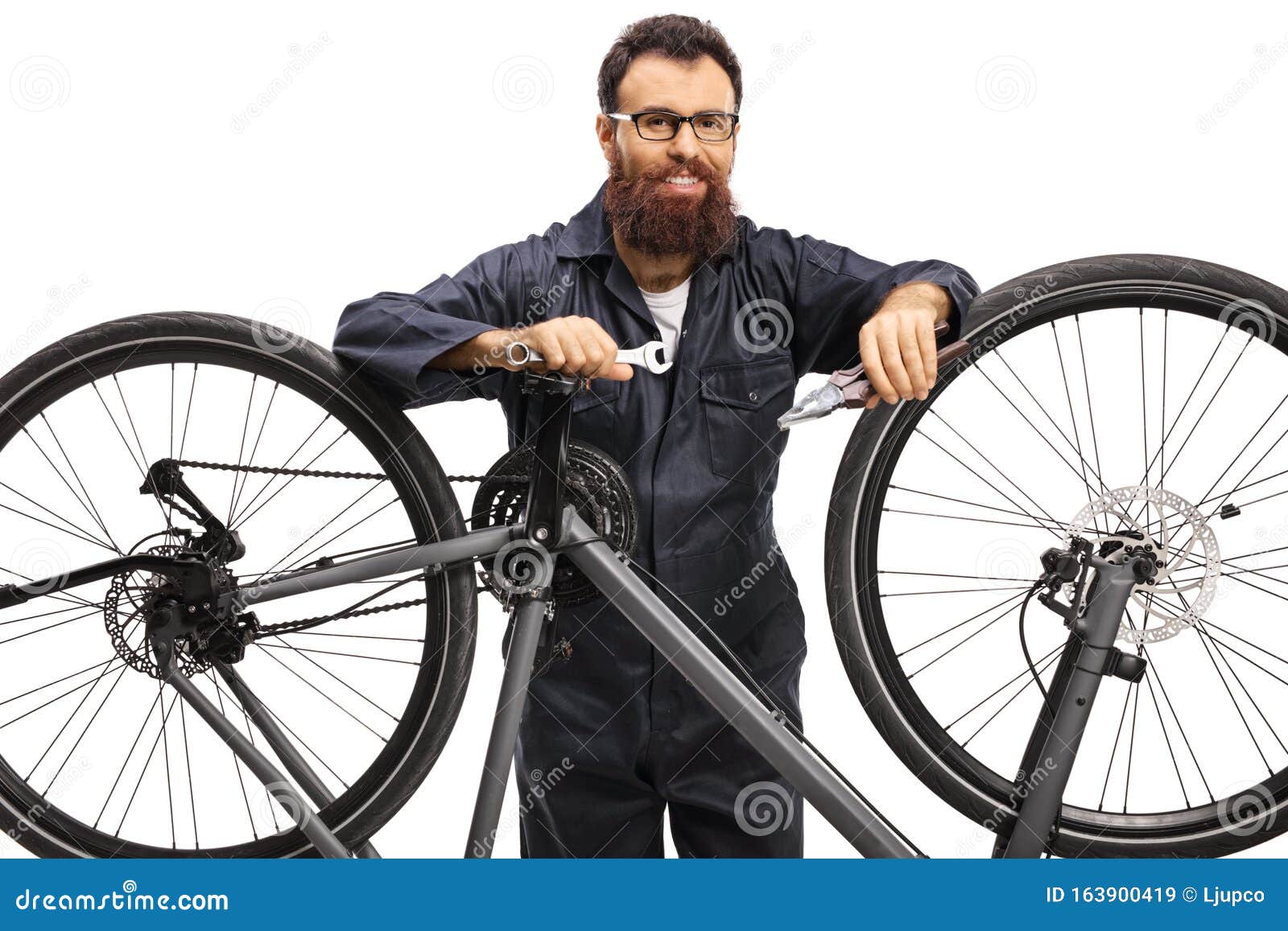 Male Worker Fixing a Bicycle Stock Image Image of bicycle