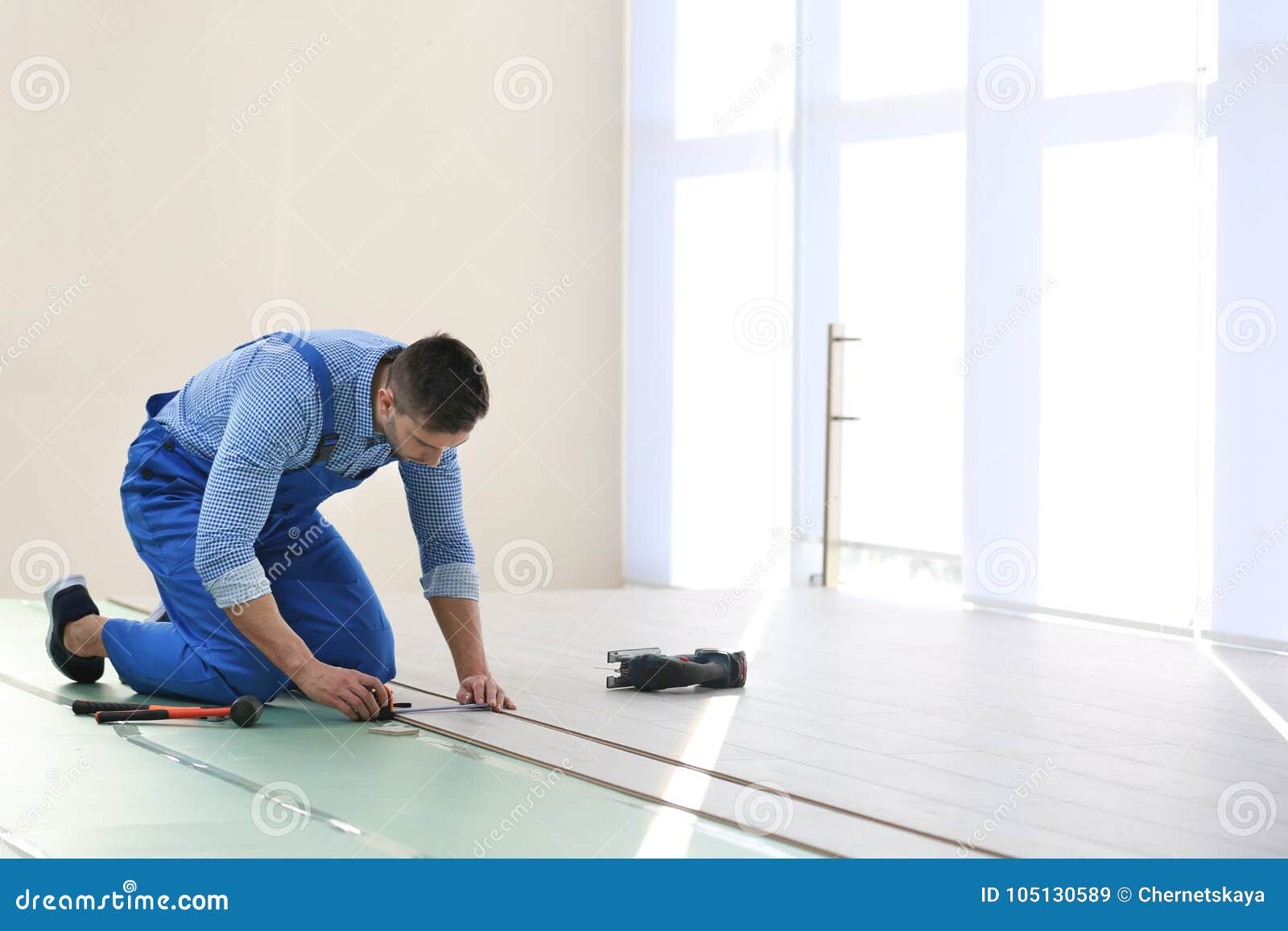 Male Worker Installing Flooring Stock Image Image of overalls, floor