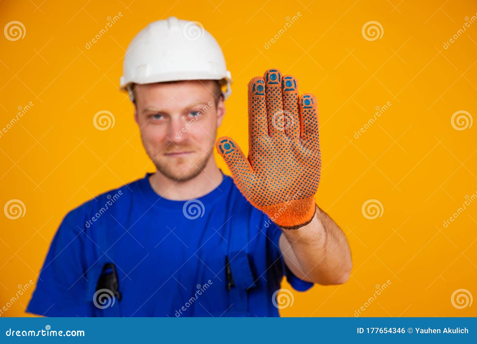 Male Worker Shows Stop Hand Gesture. Worker in Overalls and Protective ...