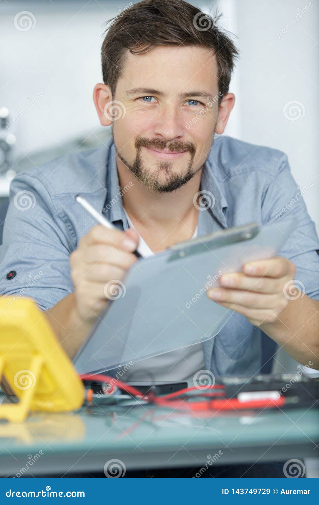 Male Worker Writing on Clipboard Stock Image Image of check, assembly