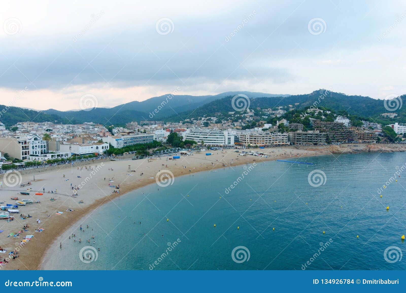 malgrat de mar, catalonia, spain, august 2018. view of the beach, the city and the distant mountains from the walls of the old for