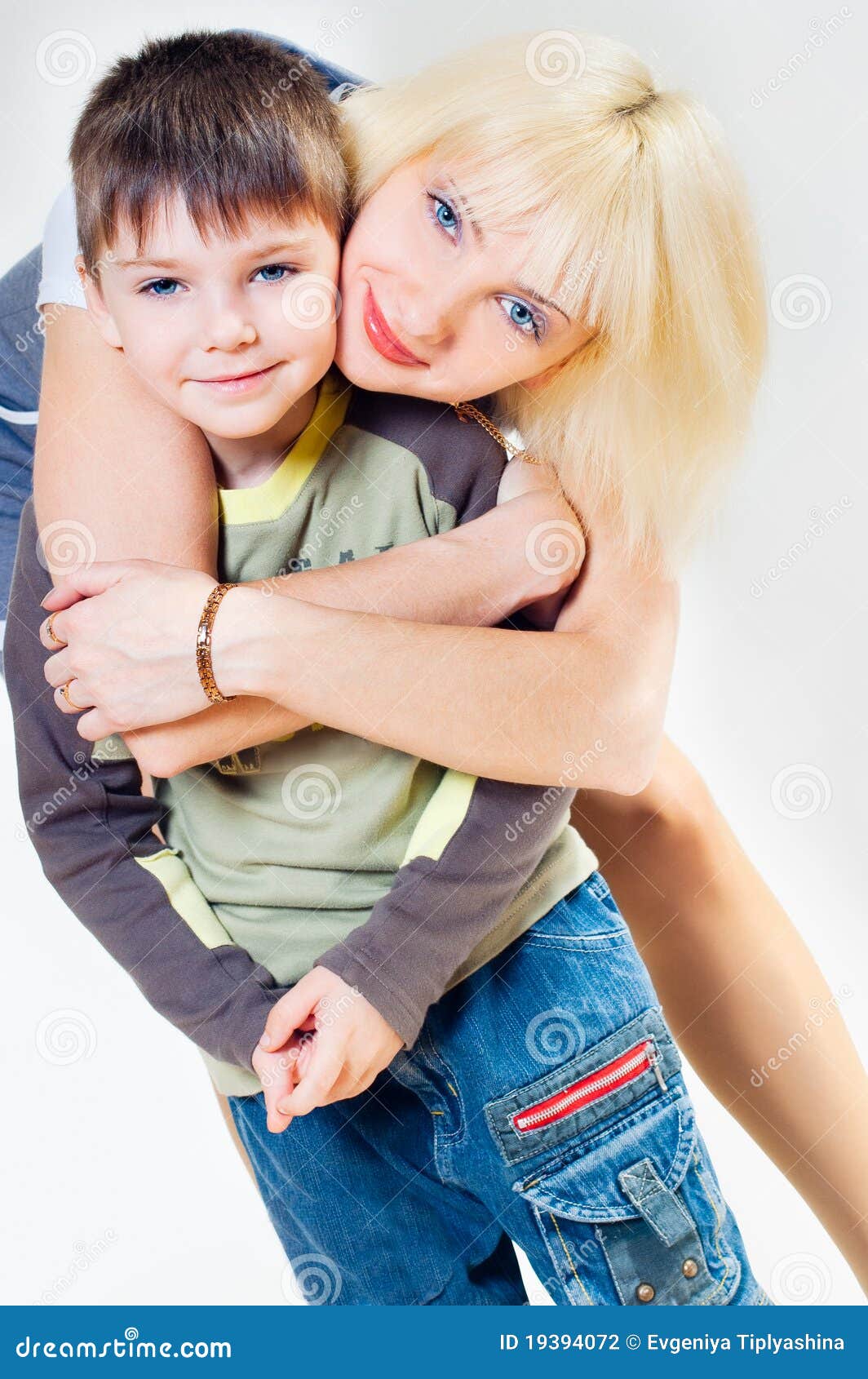 Mama hugs her son stock photo. Image of female, child 19394072