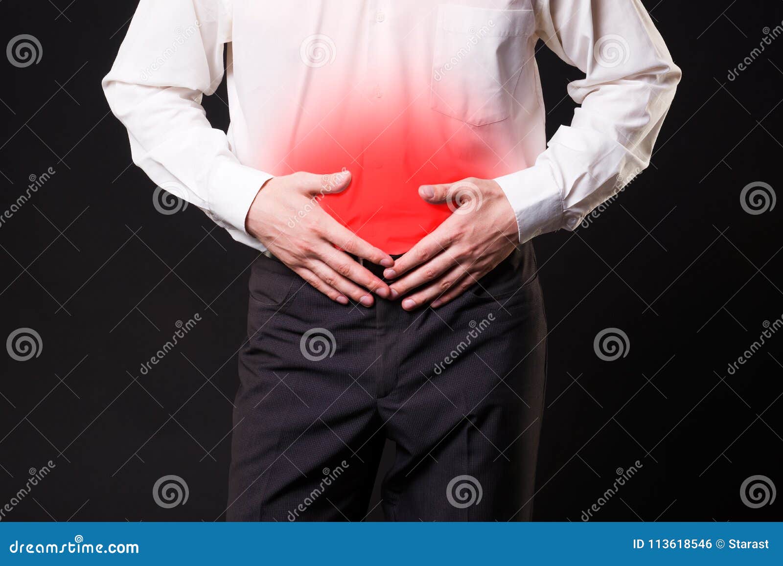 man-with-abdominal-pain-stomach-ache-on-black-background-stock-photo