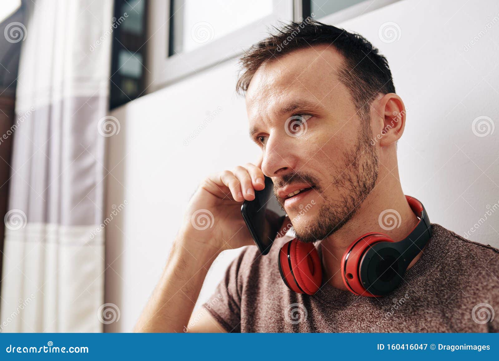 Man answering phone call stock image. Image of modern - 160416047