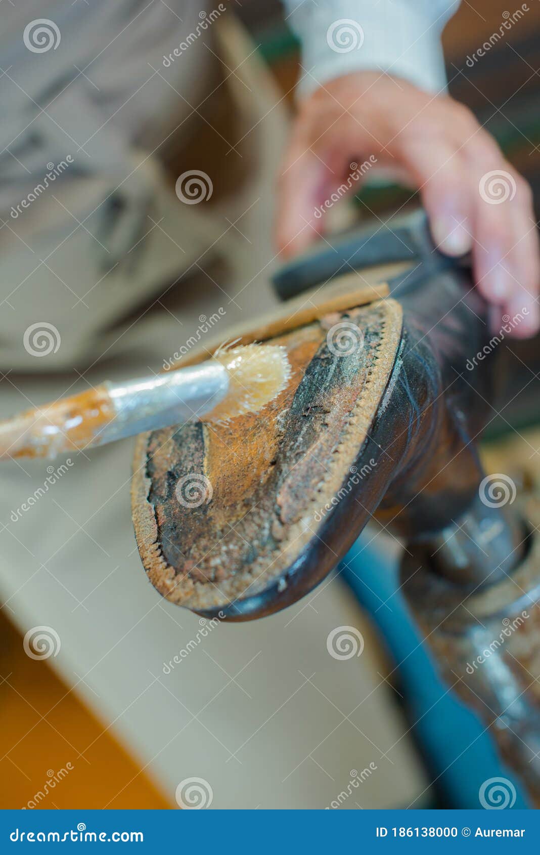 Man applying adhesive stock photo. Image of practical 186138000