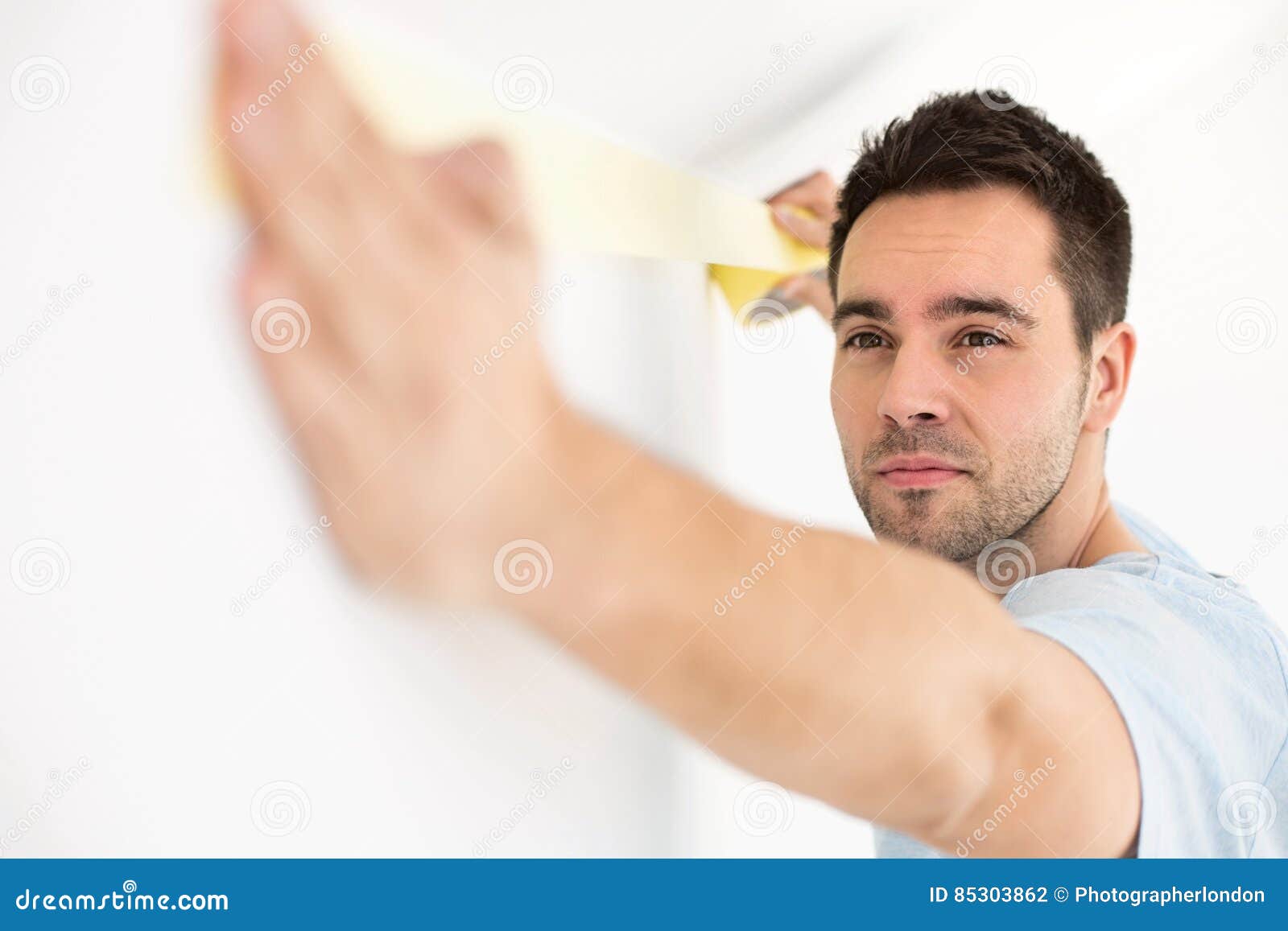 Man Applying Duct Tape on Wall Stock Photo Image of improvement