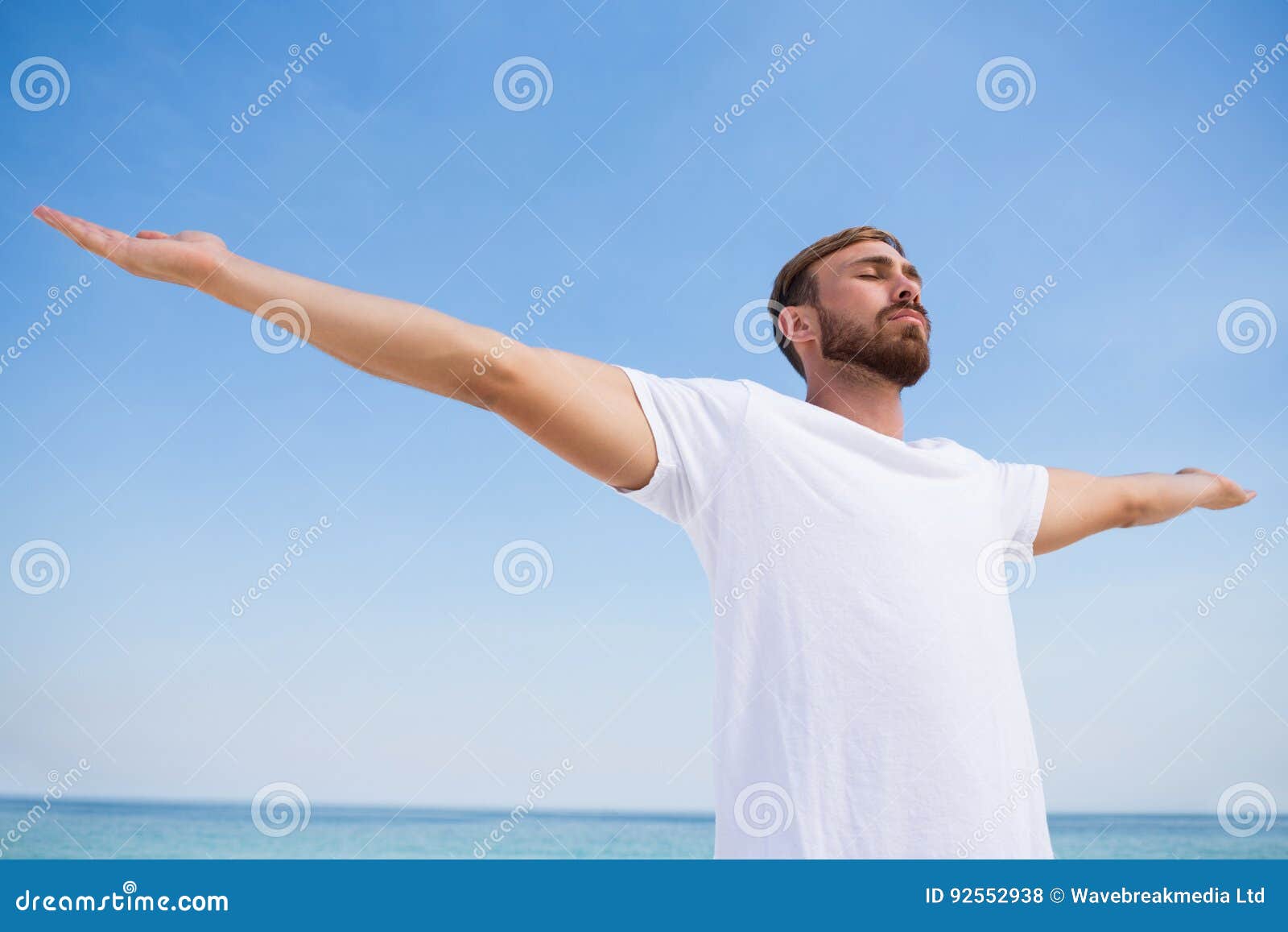 Man with Arms Outstretched Exercising at Beach Stock Photo Image of