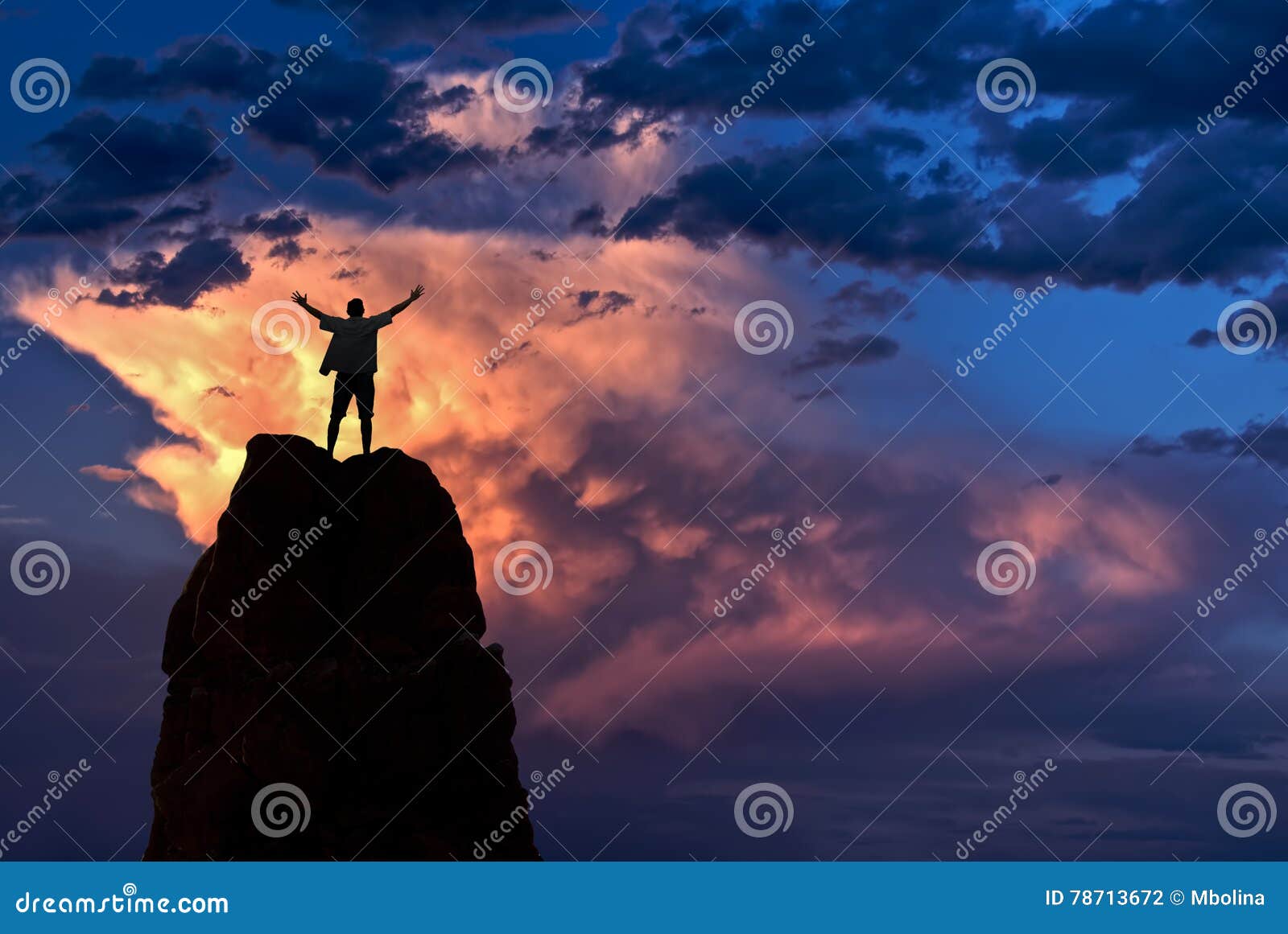 man with arms raised in the sky winner success concept