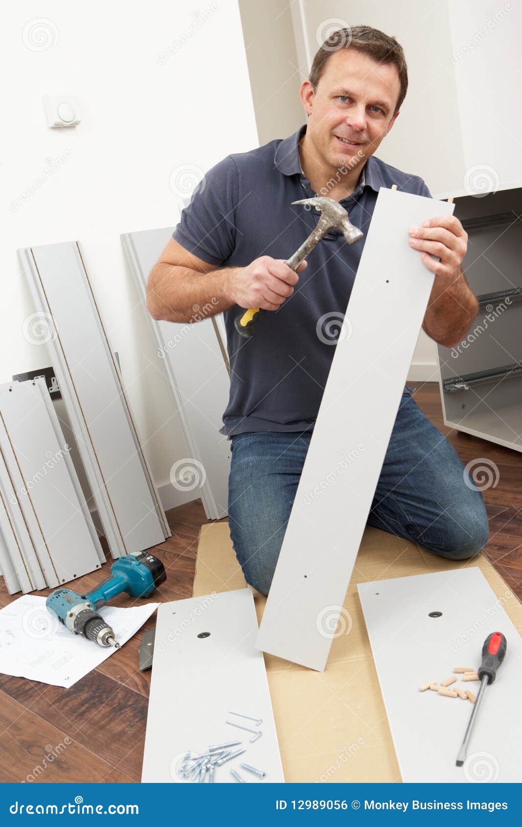 man assembling flat pack furniture