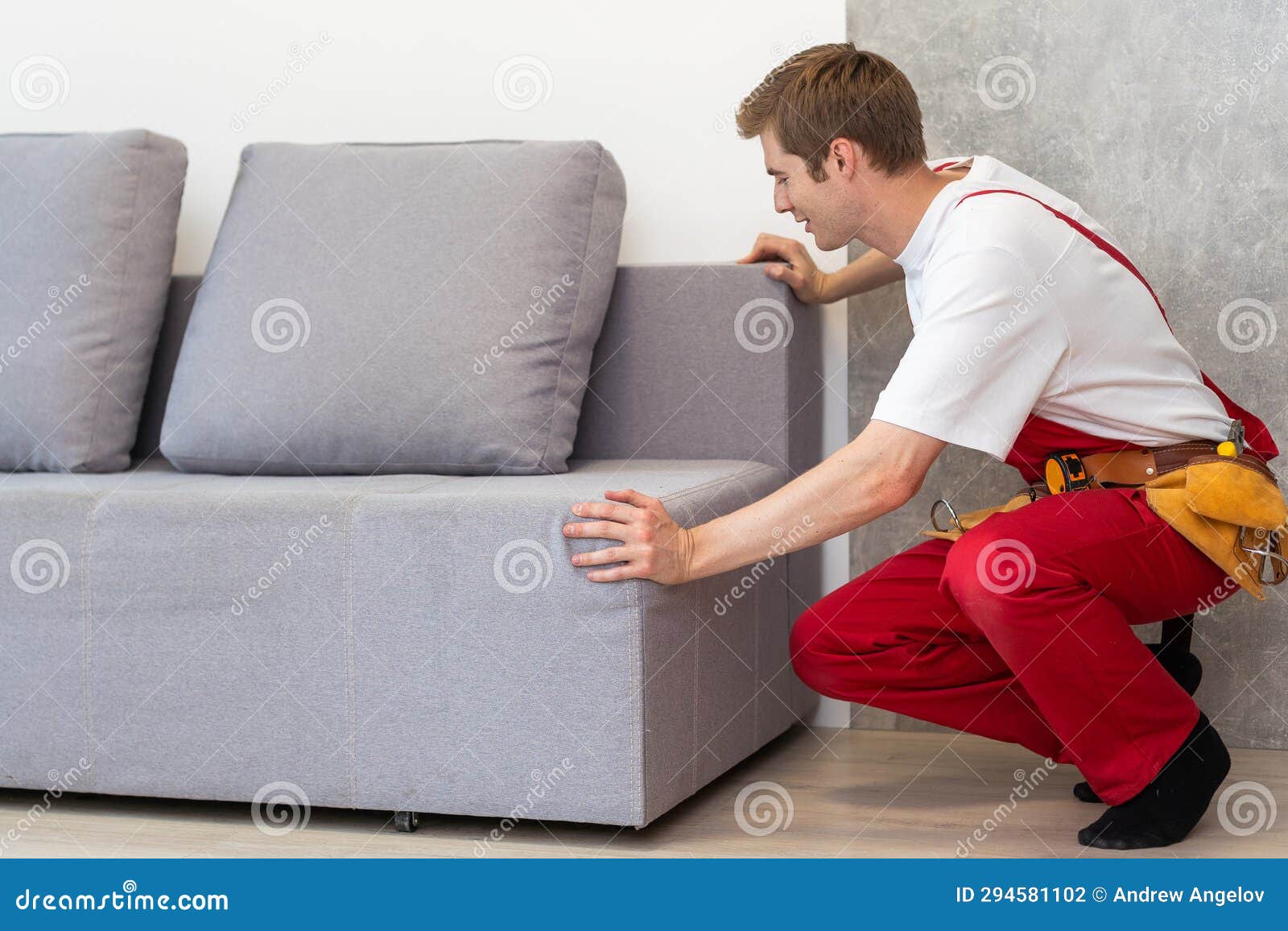 Man Assembling Sofa Furniture at Home Stock Photo Image of fasten
