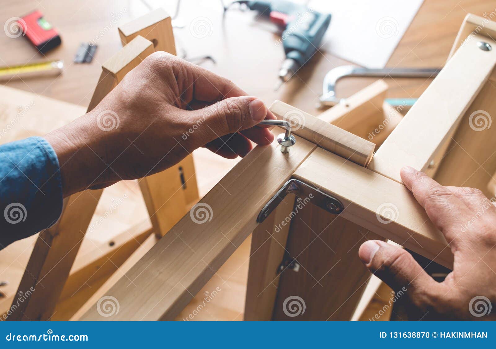 Man Assembly Wooden Furniture Fixing Or Repairing House With