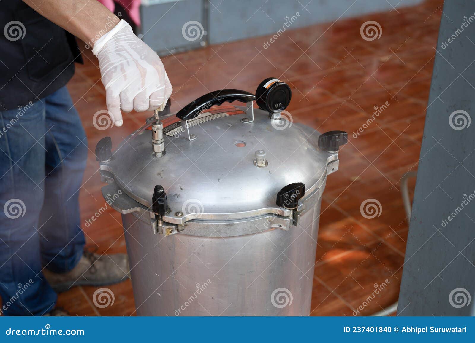 Man Assistant s Hands Open Pressure Valve on Sterilizing Medical