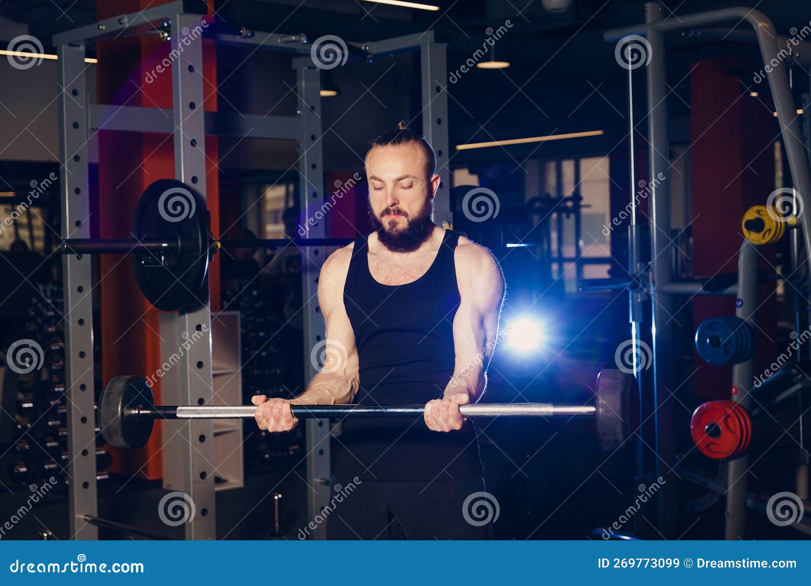 A Man of Athletic Build is Preparing To Perform an Exercise with a Barbell Stock Image Image