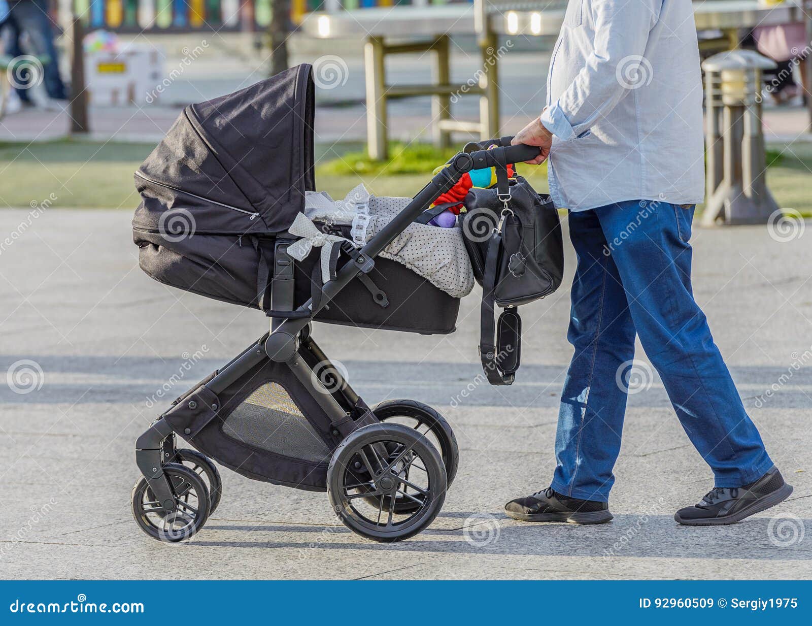 Man with a Baby Stroller on a Walk Stock Image Image of family, daddy