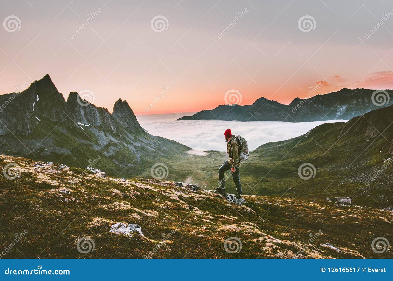 man backpacker hiking in mountains alone outdoor