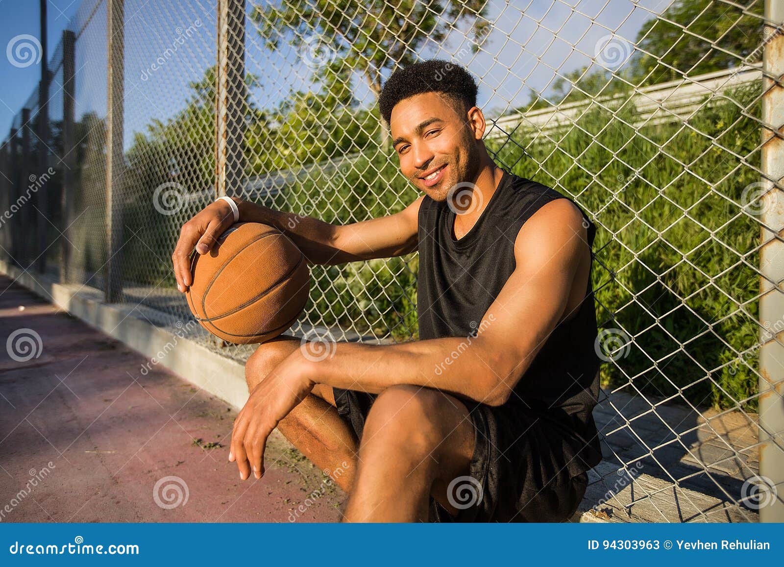 Man with Ball on Basketball  Looking To the Camera on a  Basketball Court Stock Image - Image of exercise, adult: 94303963