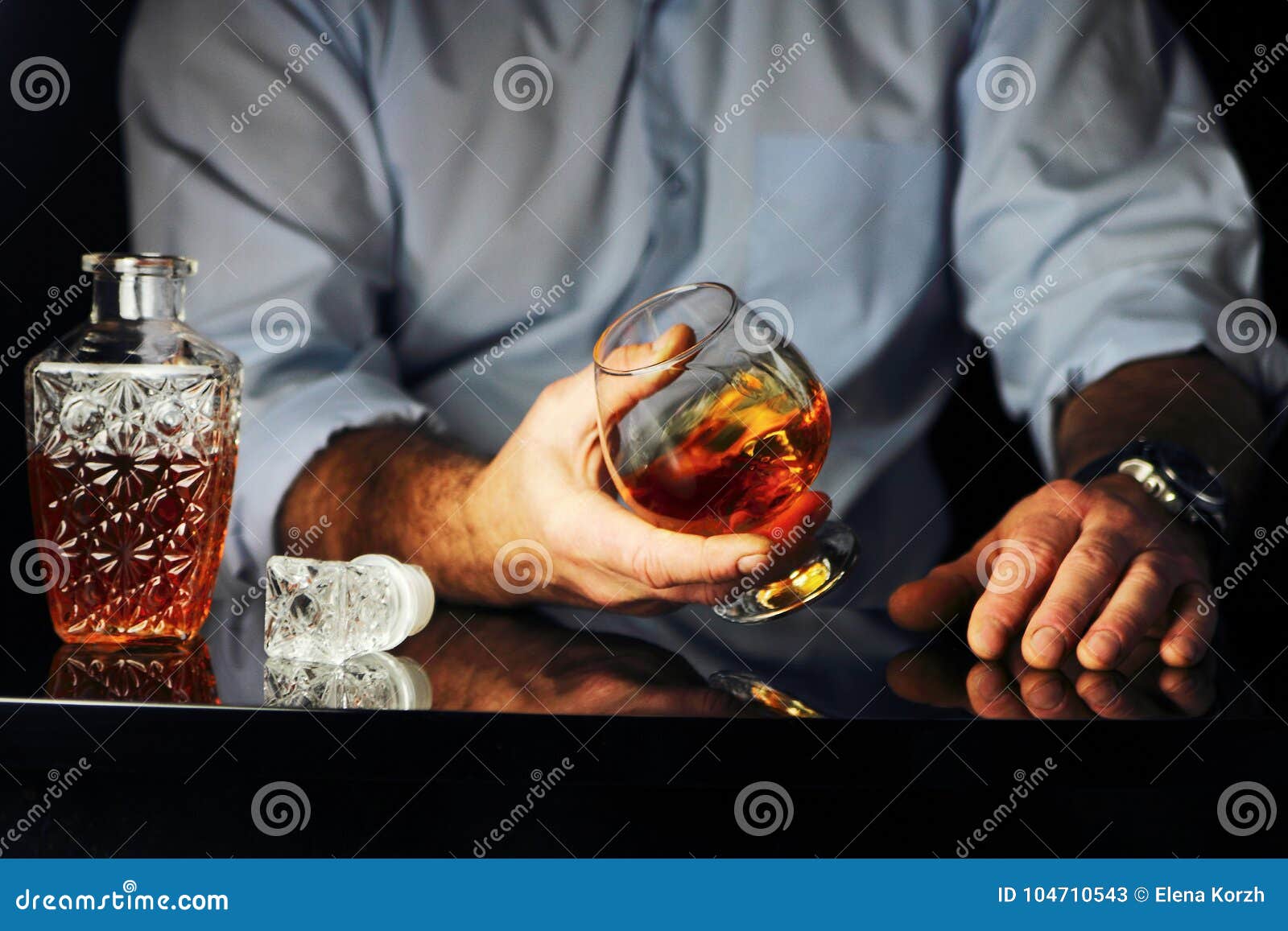 the man at the bar drinking brandy