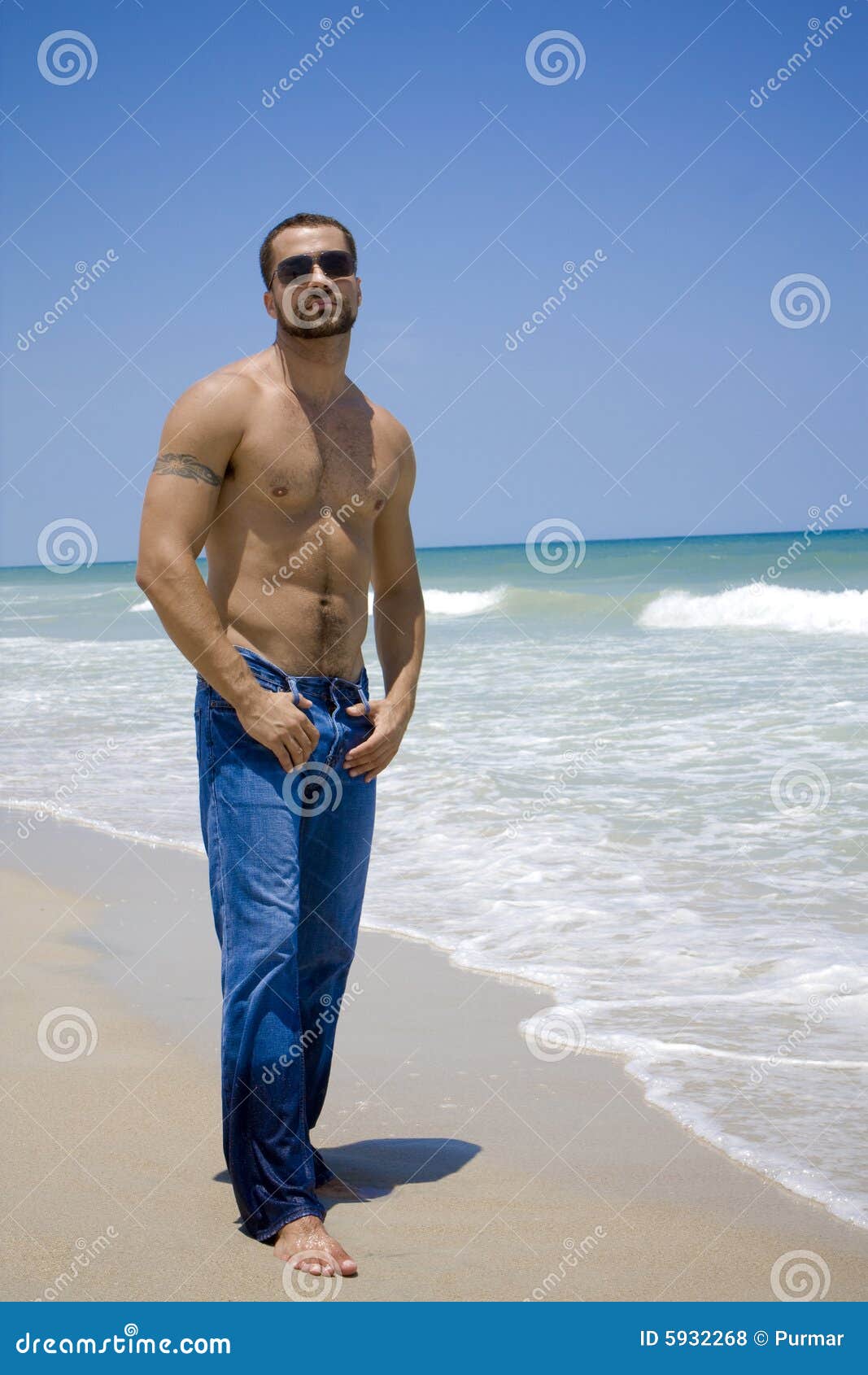 Shirtless Man Hugging Young Woman Standing in Lace Bra on Blue