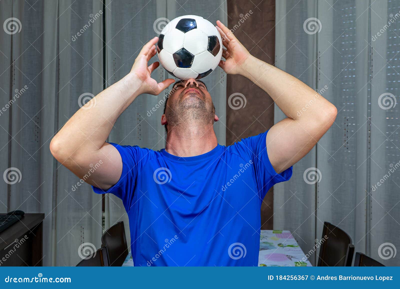 Man with a Beard and Short Hair in a Blue Shirt Trying To Control a Soccer  Ball with His Head Stock Image - Image of person, control: 184256367