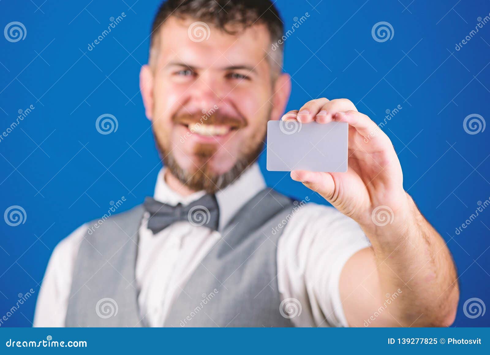 Man Bearded Hipster Hold Blank Card Blue Background. Take this Card